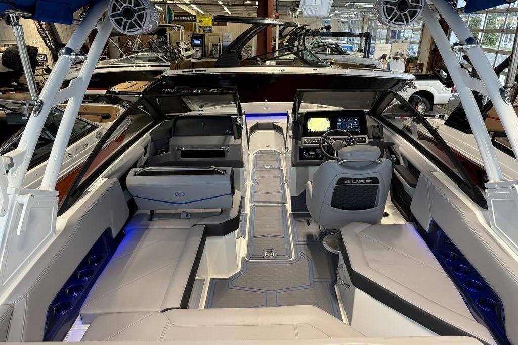 2026 Cobalt R4 Surf boat interior with modern dashboard and seating in showroom.