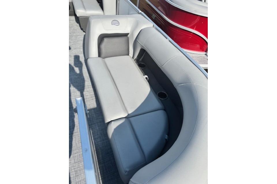2026 Sun Tracker Party Barge 18 DLX interior with comfortable seating and cup holders.