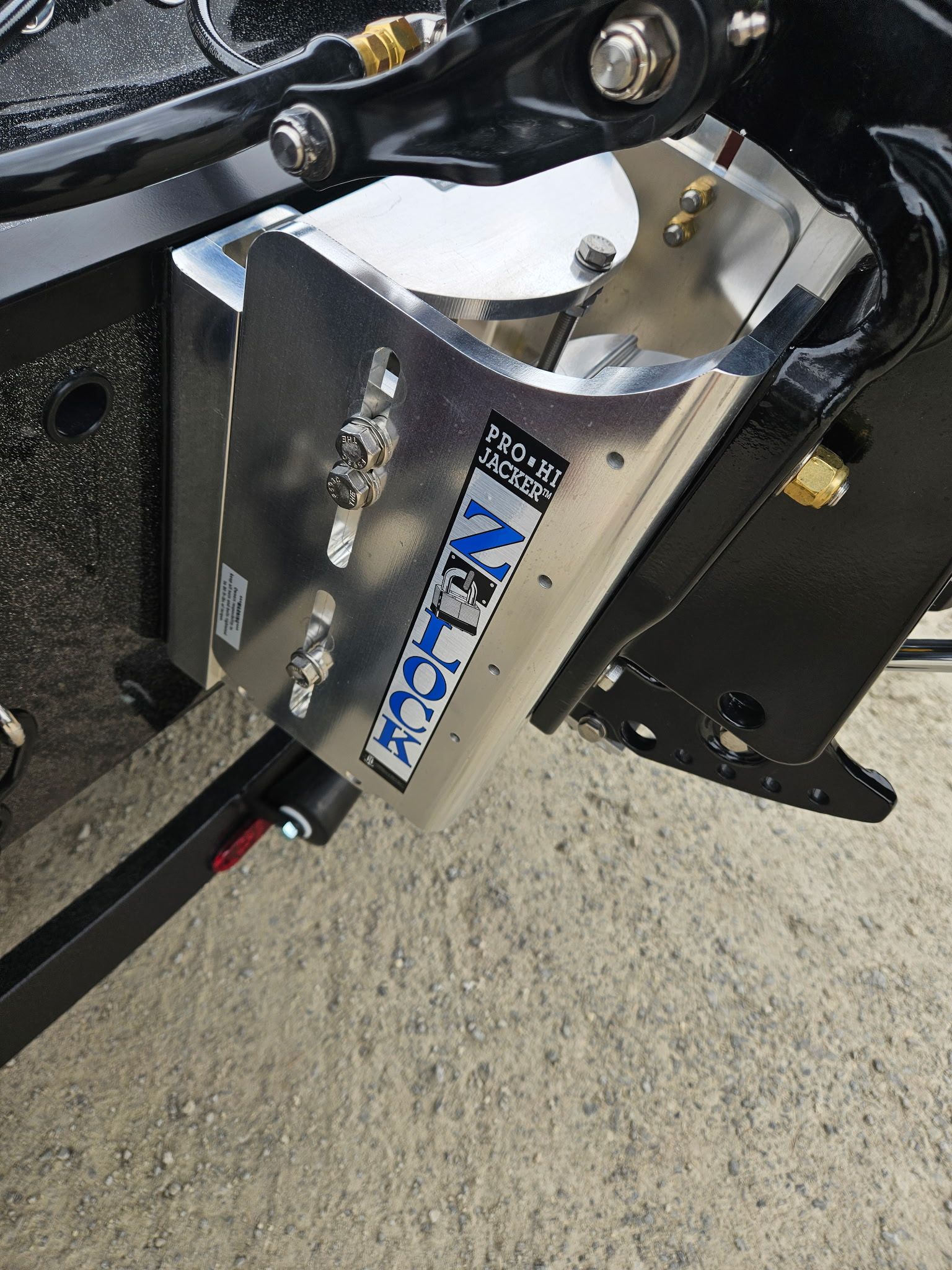Close-up of a Pro-Hi Jackplate on a 2027 Caymas CX 21 PRO.