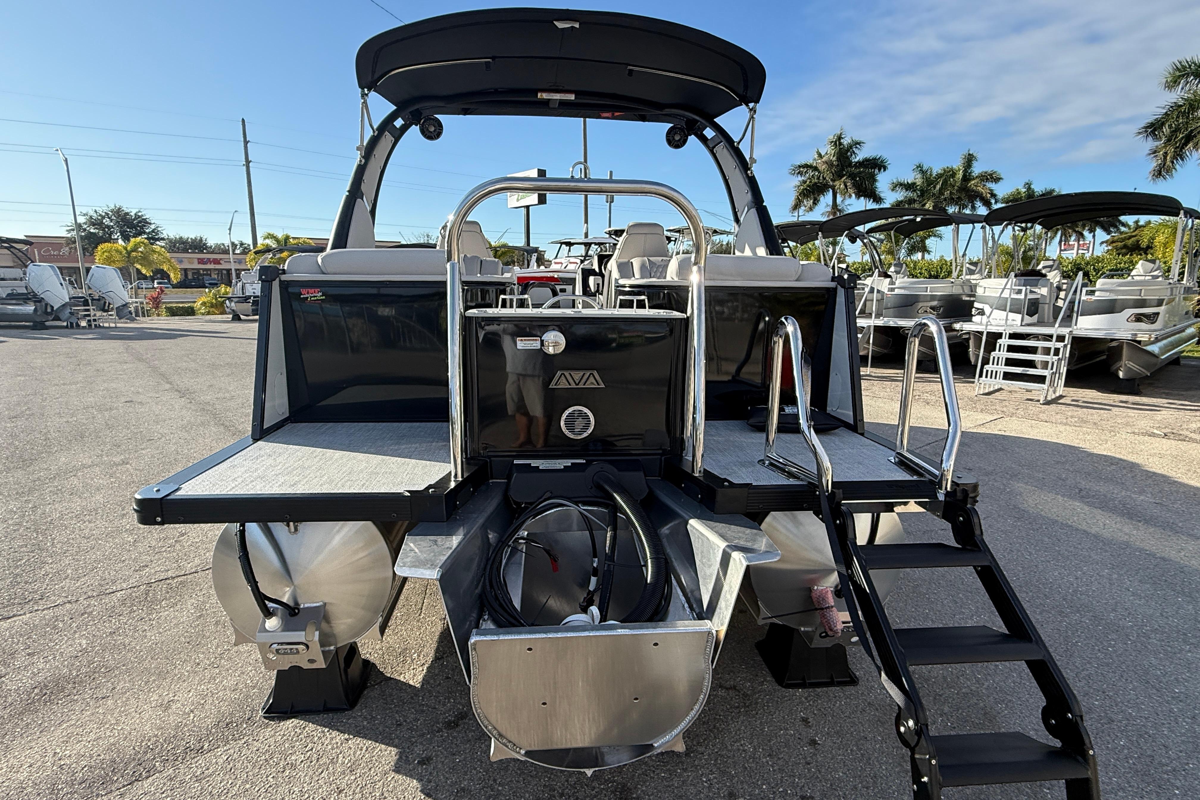 2026 Avalon 2385 Catalina Quad Lounger, Tri Toon High Performance boat, rear view with ladder.