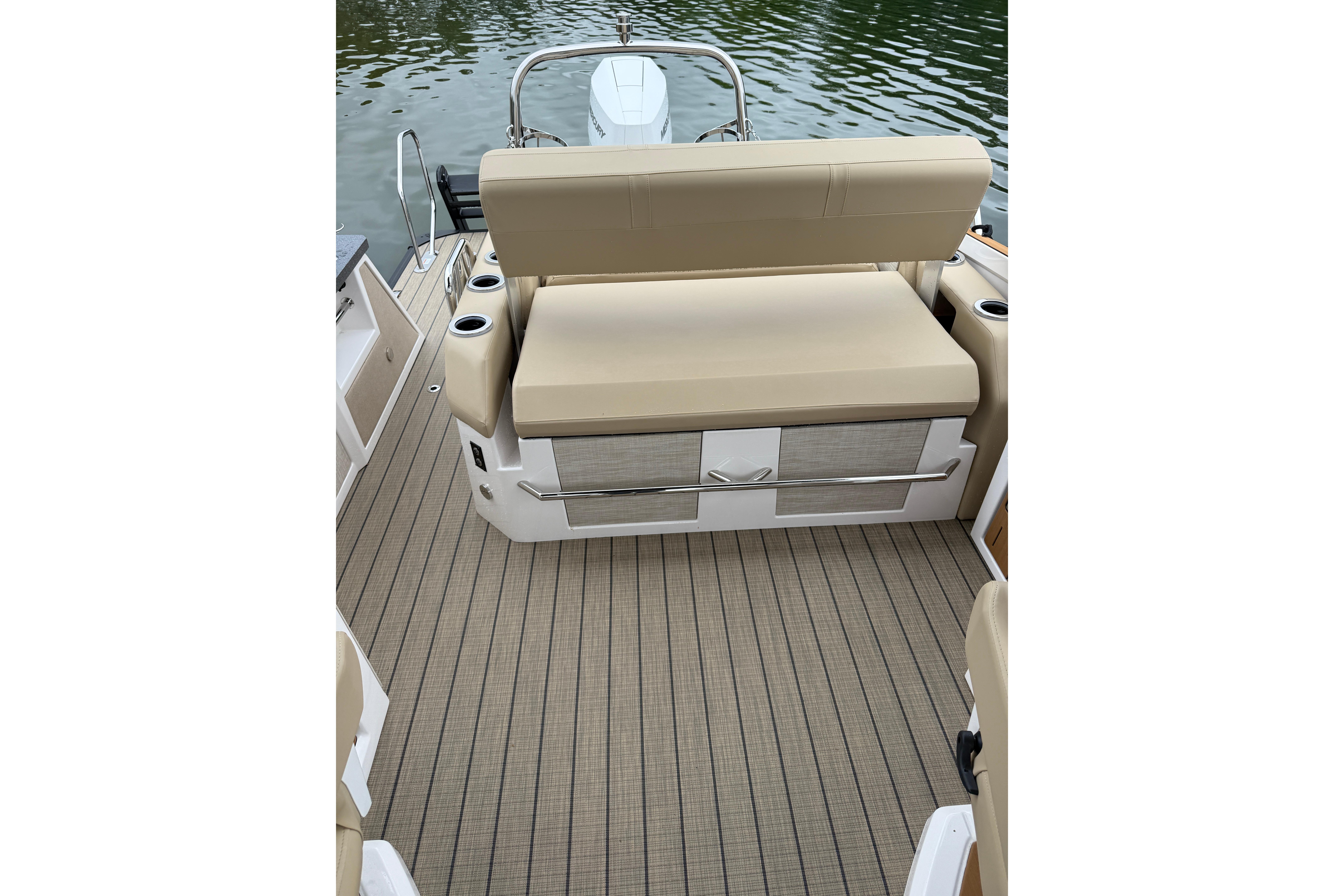 2025 Balise Helix 26 L boat interior with beige seating and striped flooring.