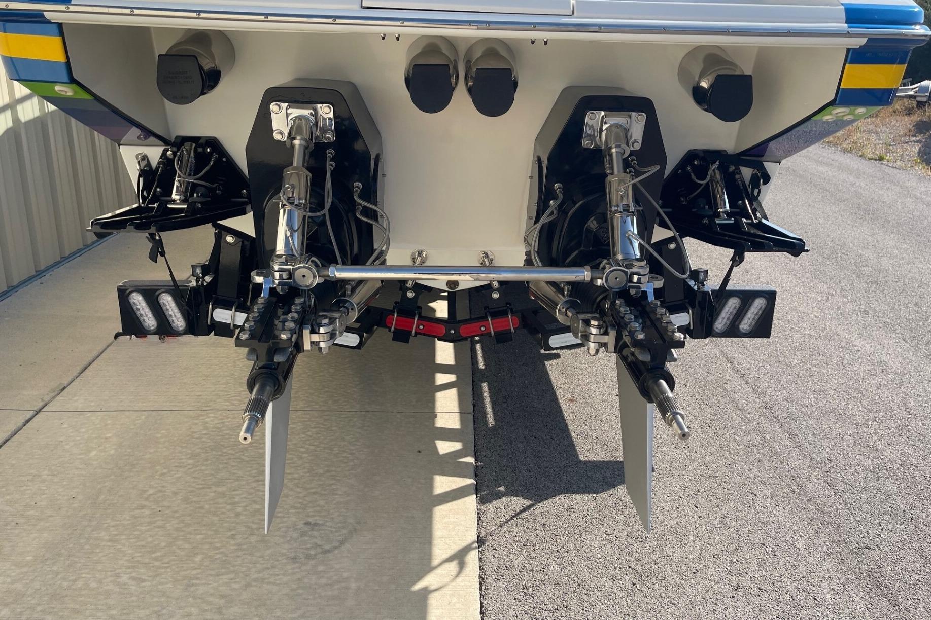 Rear view of a 2004 Formula 382 FASTech boat showing dual outdrives and propellers.