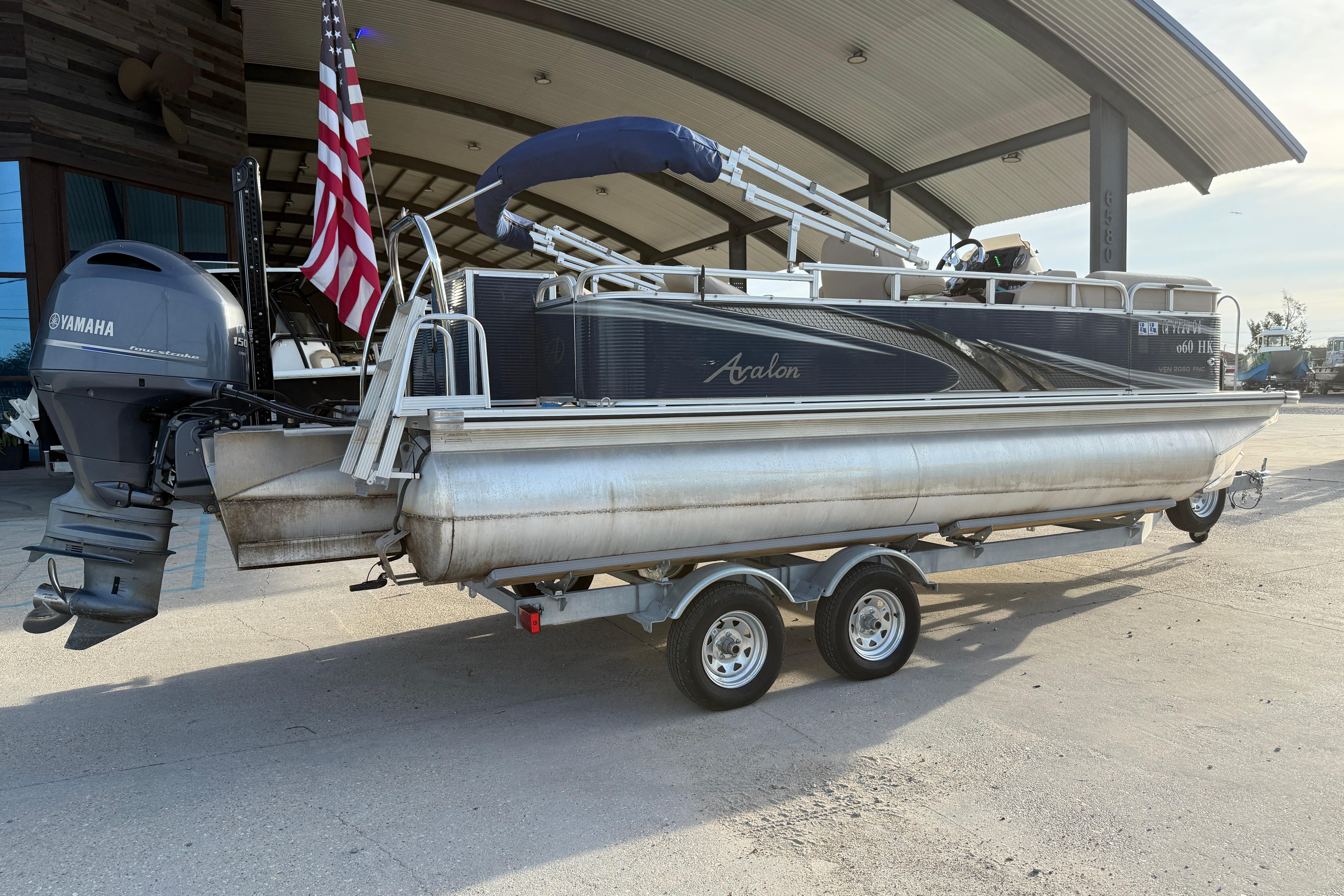 2019 Avalon Venture Fish N Cruise pontoon boat on trailer with Yamaha outboard motor.