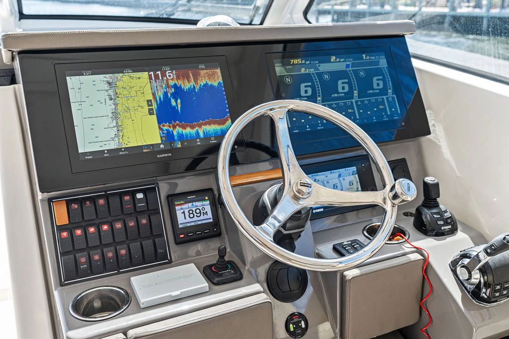 2019 Pursuit 365 DC helm with advanced navigation systems.