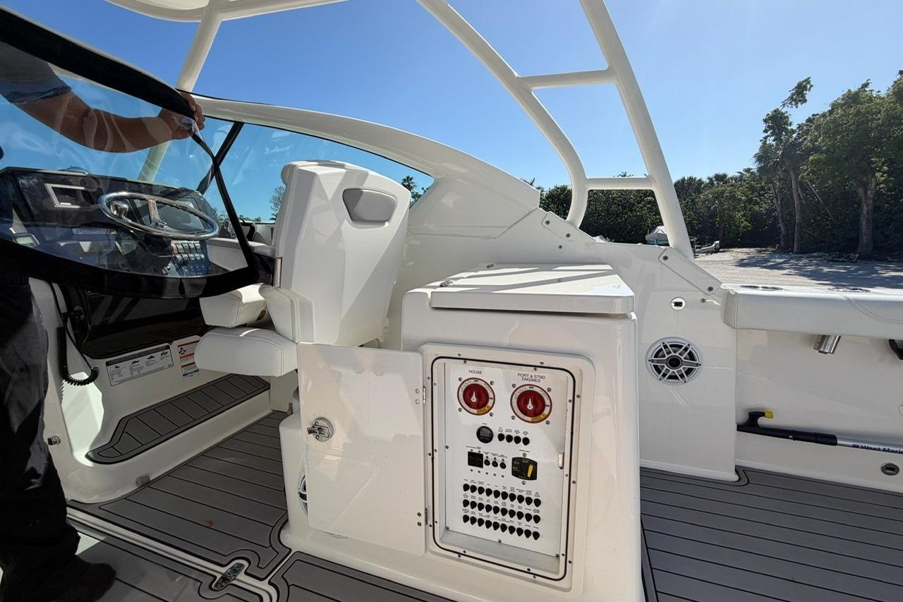 2021 Pursuit DC 266 Dual Console boat interior with control panel and seating.