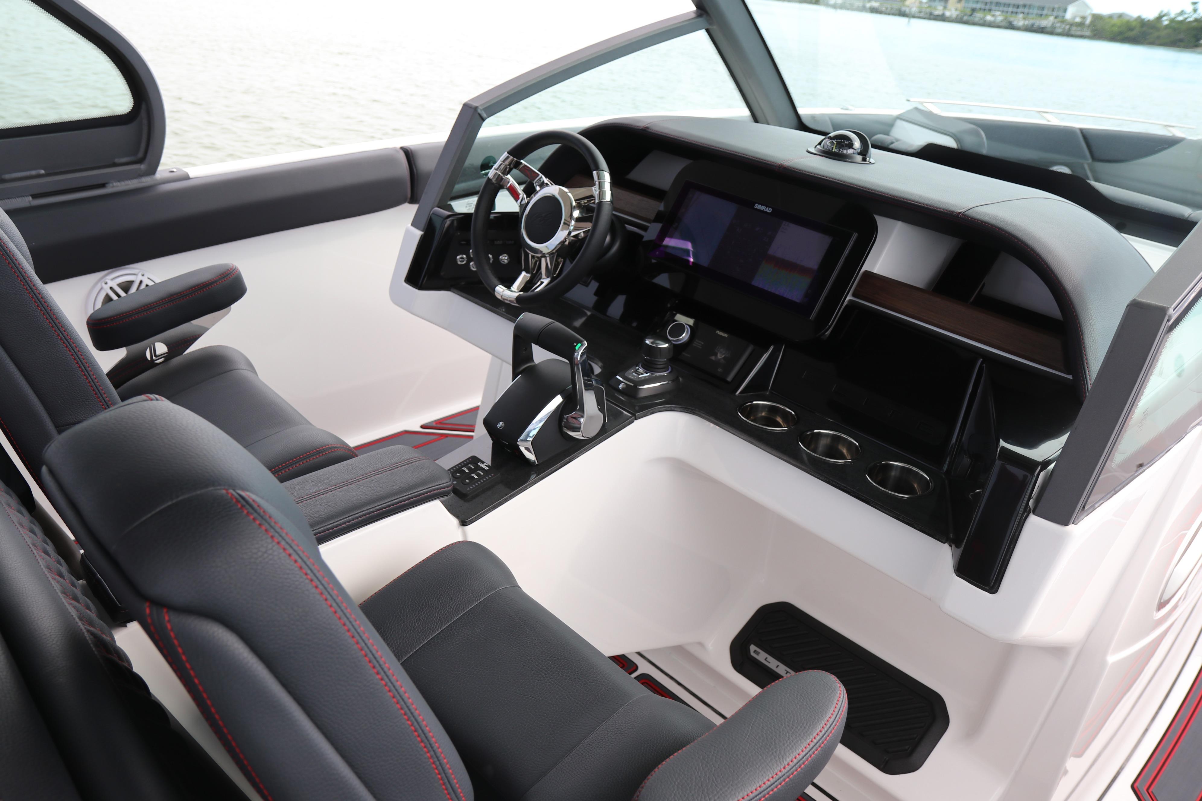 2026 Monterey Elite 30 OB boat interior with modern dashboard and steering wheel.