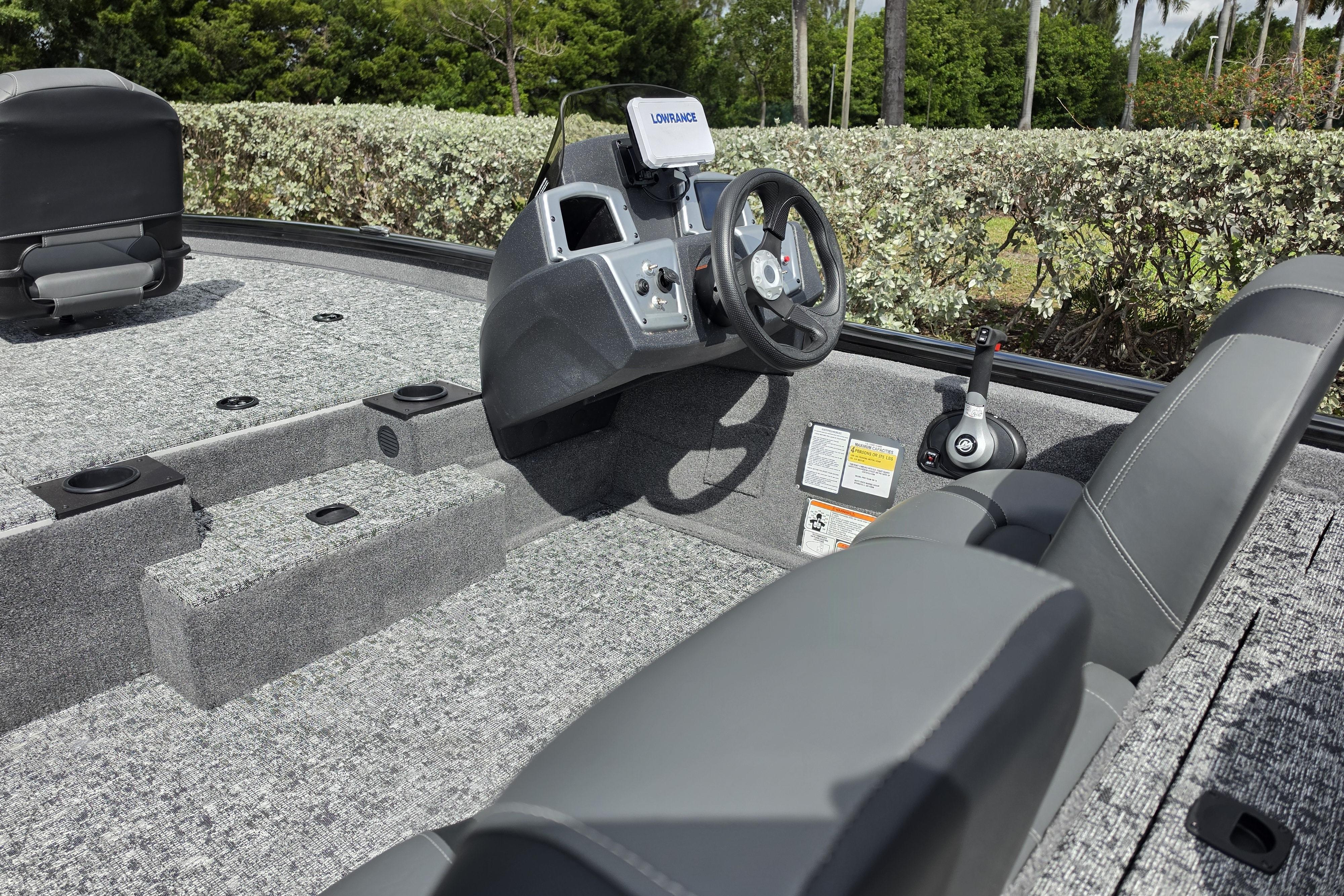 Interior view of 2026 Tracker Pro Team 190 boat with steering console and seating.