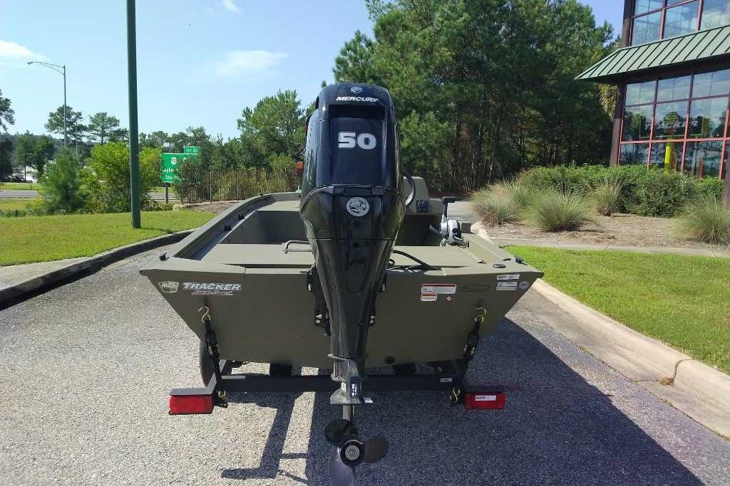 2026 Tracker Grizzly 1648 SC boat with Mercury 50 engine, parked outdoors.