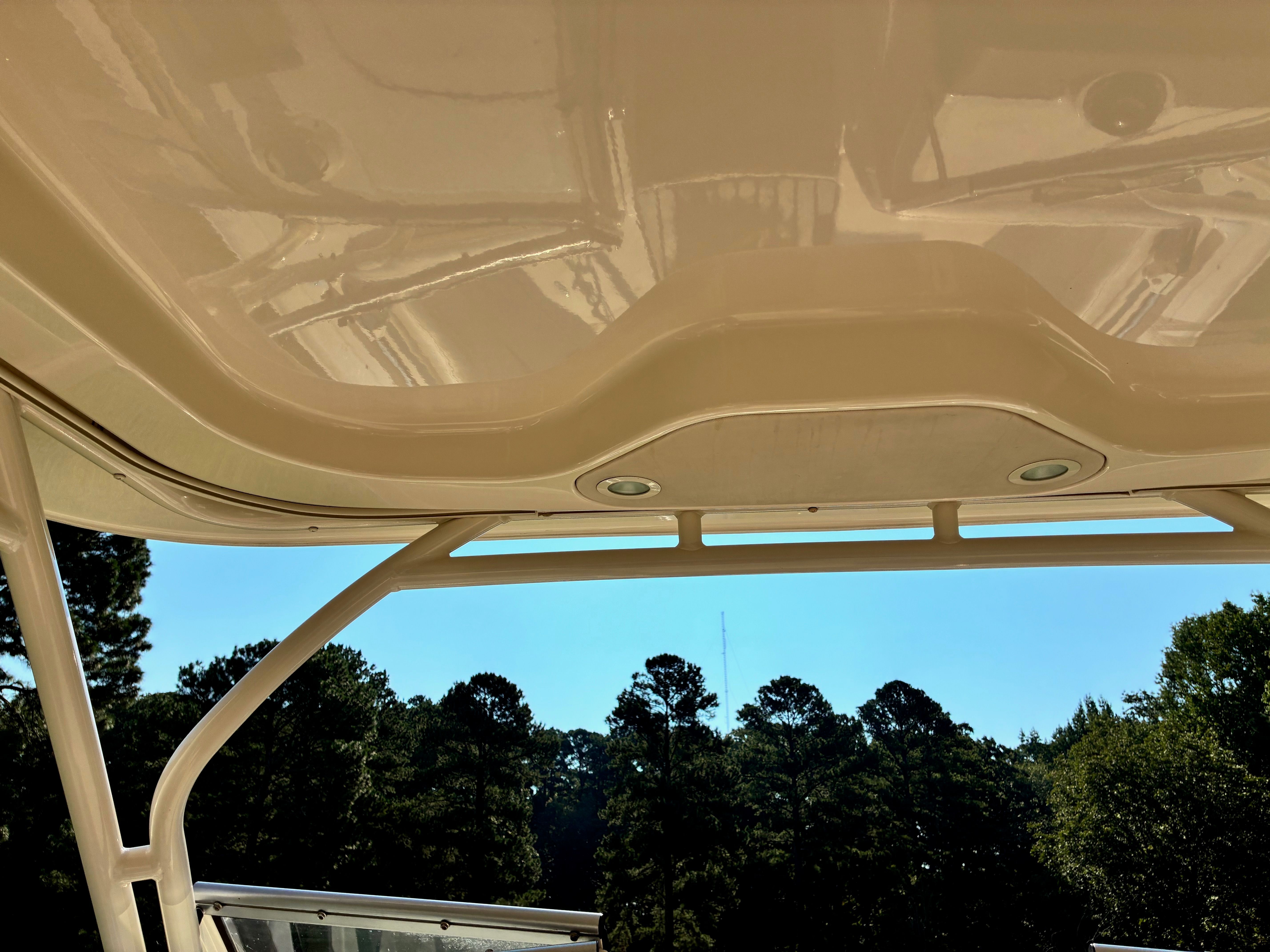 Grady-White Freedom235 2018 boat roof with forest background.