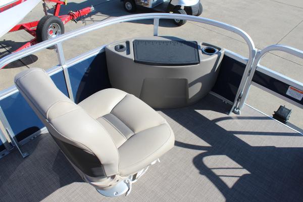 2024 Sun Tracker BB18 boat interior with beige seating and cup holders.