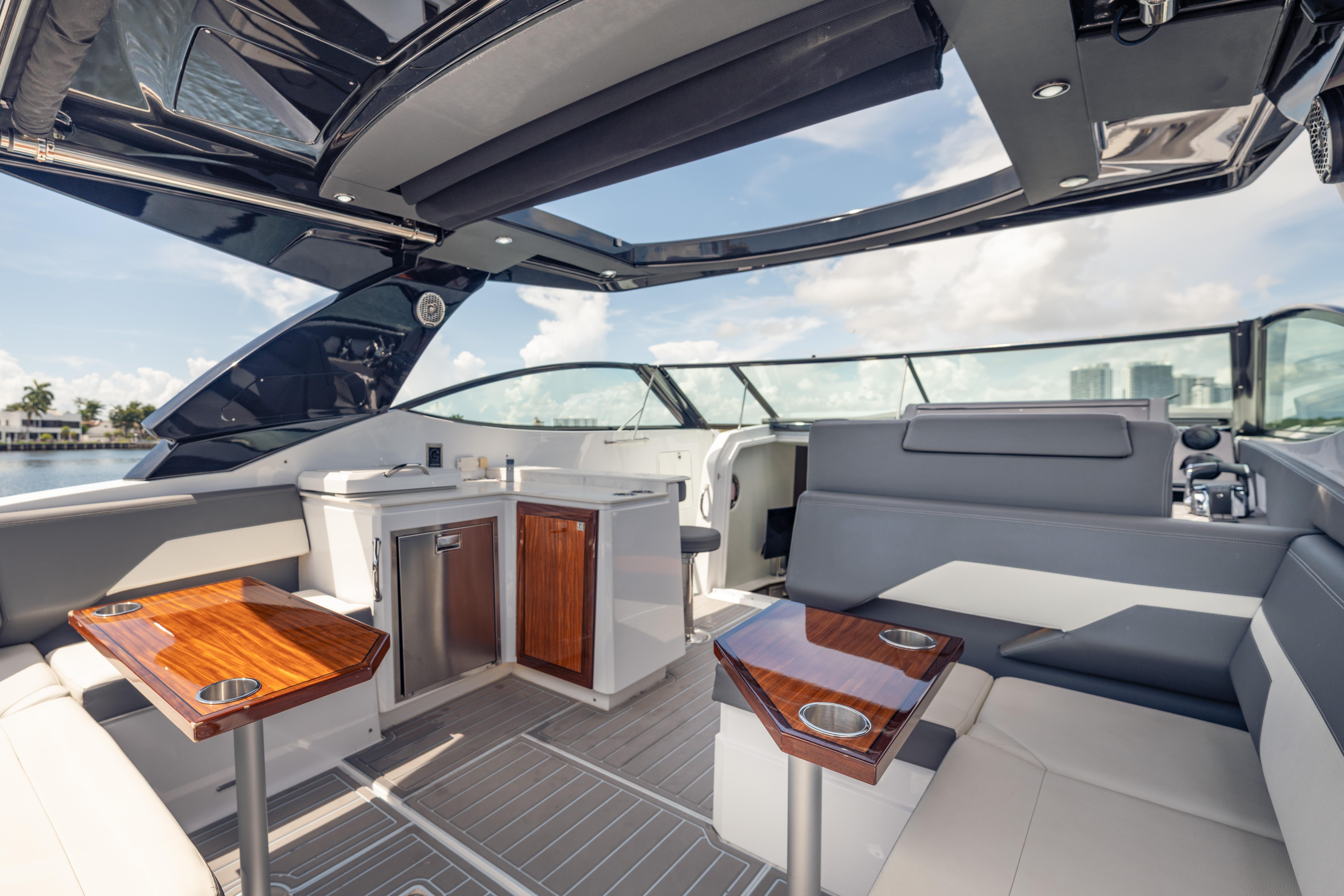 Luxurious interior of 2021 Cruisers Yachts 38 GLS with sleek seating and modern amenities.