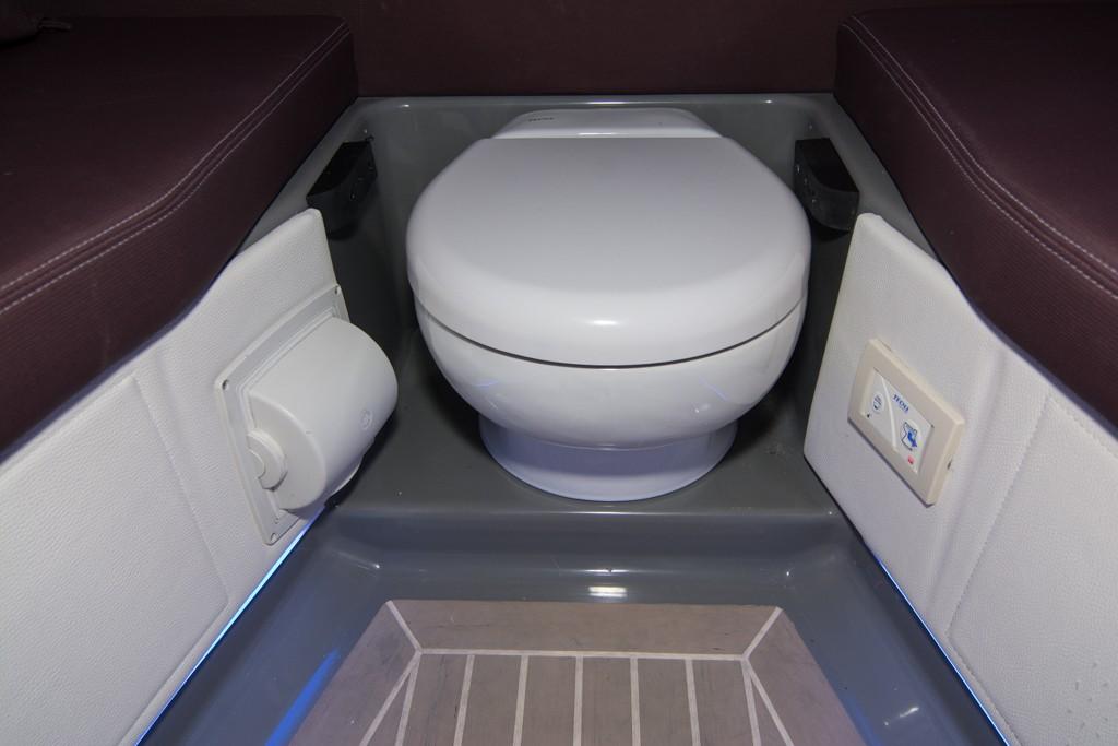 2019 Donzi 41 GT boat interior bathroom with toilet and seating.