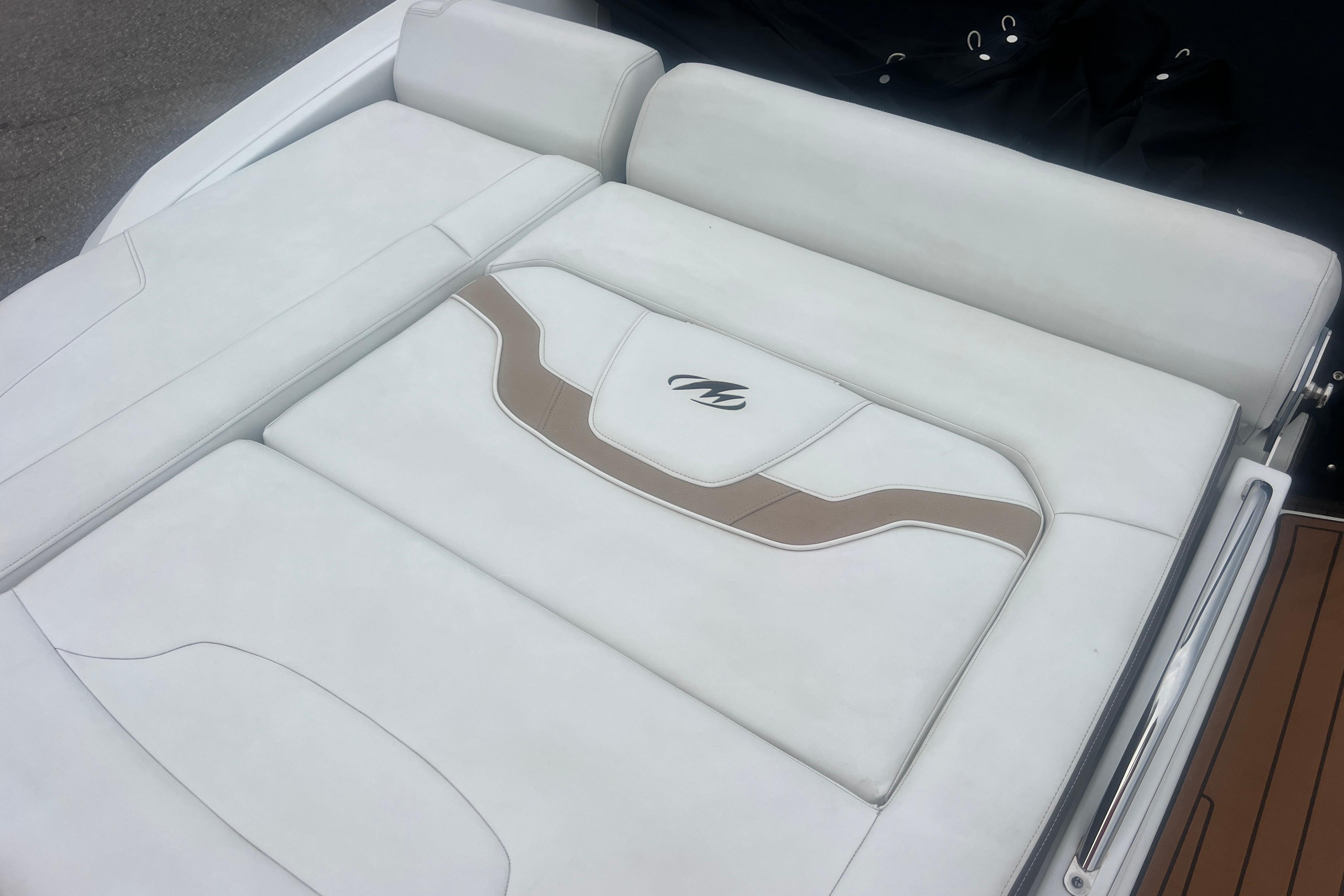 Luxurious seating on a 2017 Monterey 298SS Super Sport boat, featuring white and tan upholstery.