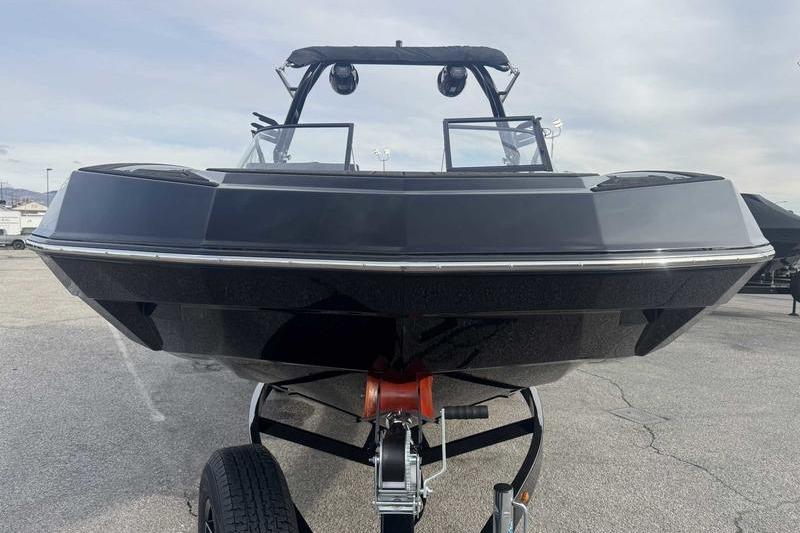 2026 Moomba Tykon boat on trailer, front view, sleek black design.
