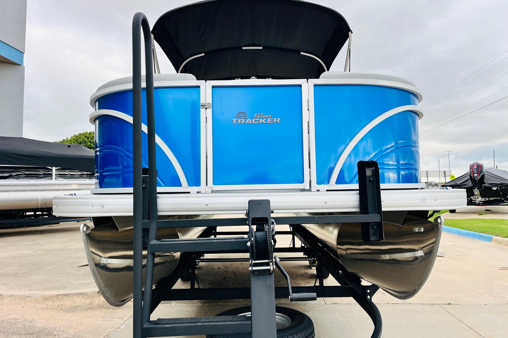 2026 Sun Tracker Party Barge 22 RF DLX pontoon boat on trailer.