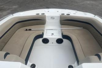 2021 Hurricane SunDeck Sport 192 RL OB boat interior with beige seating and storage compartments.