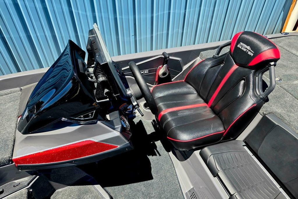 2026 Skeeter ZXE20 boat cockpit with black and red seating, steering console, and controls.