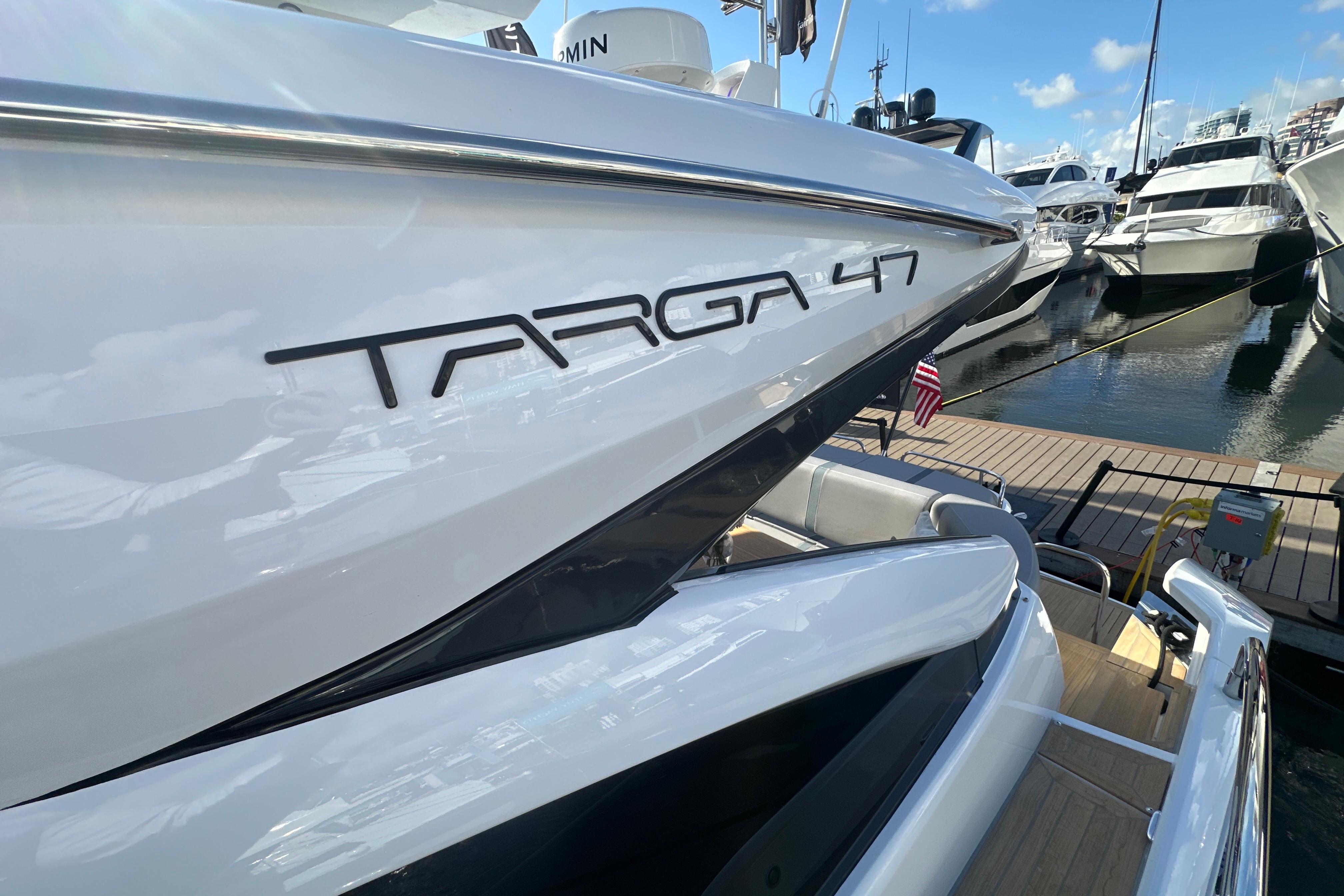 2026 Fairline Targa 47 GT yacht docked at marina, showcasing sleek design.