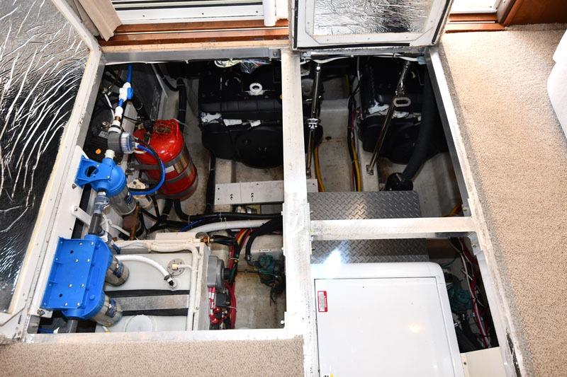 Engine room of a 2008 Carver 43 Super Sport yacht, showcasing mechanical components.