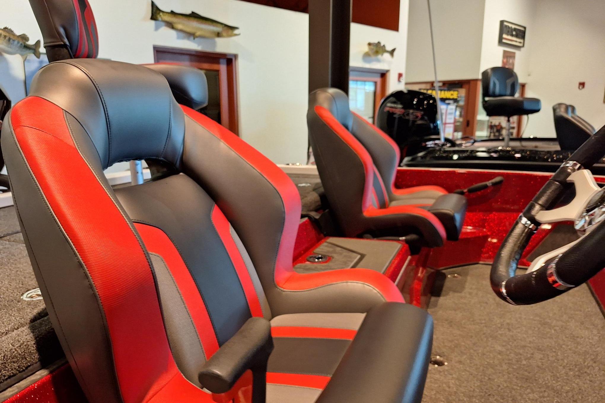 2026 Nitro Z19 XL Pro boat interior with red and black seats, steering wheel visible.