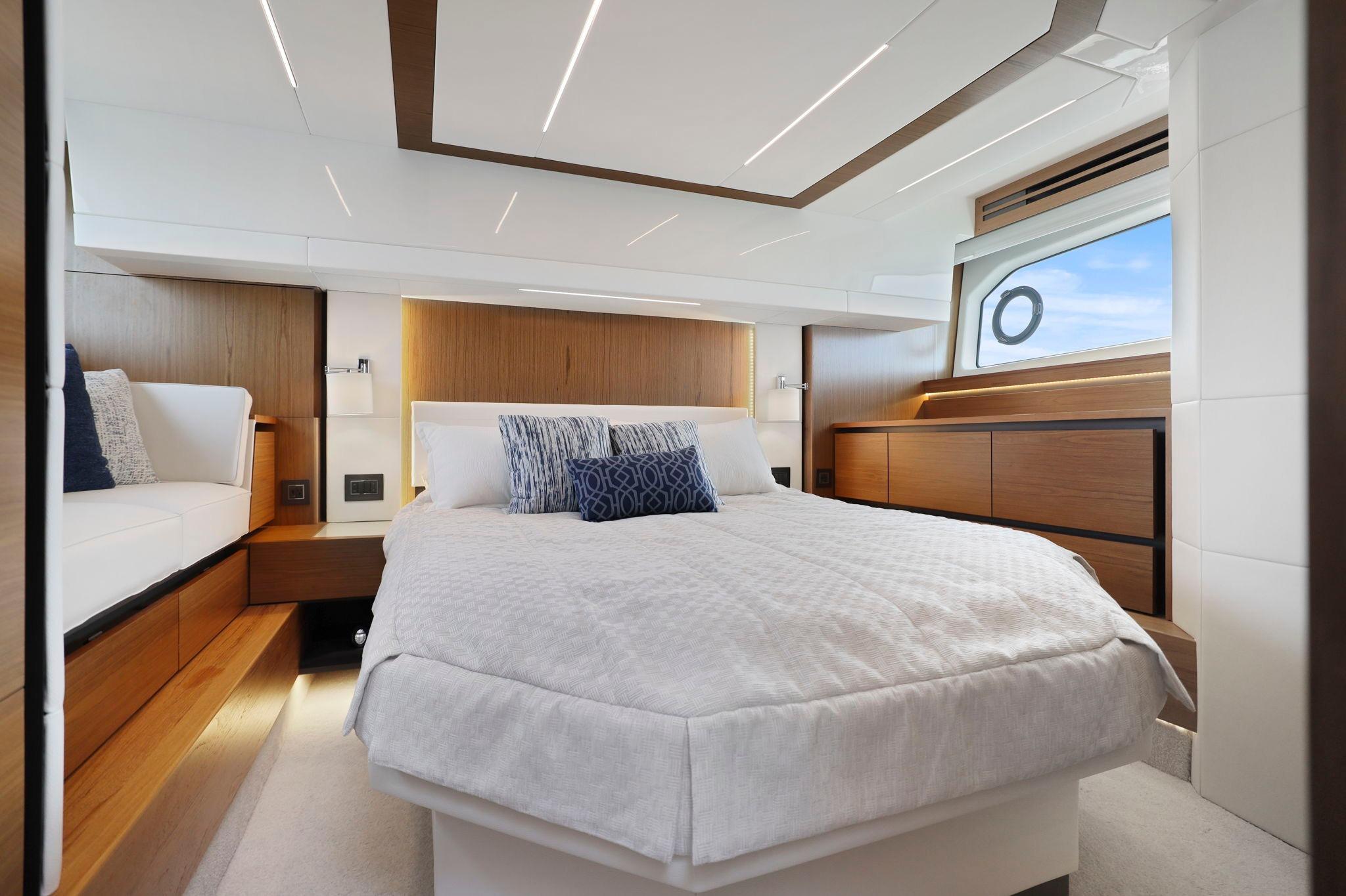 Luxurious bedroom interior of 2023 Tiara Yachts C49 Coupe with modern design and elegant furnishings.
