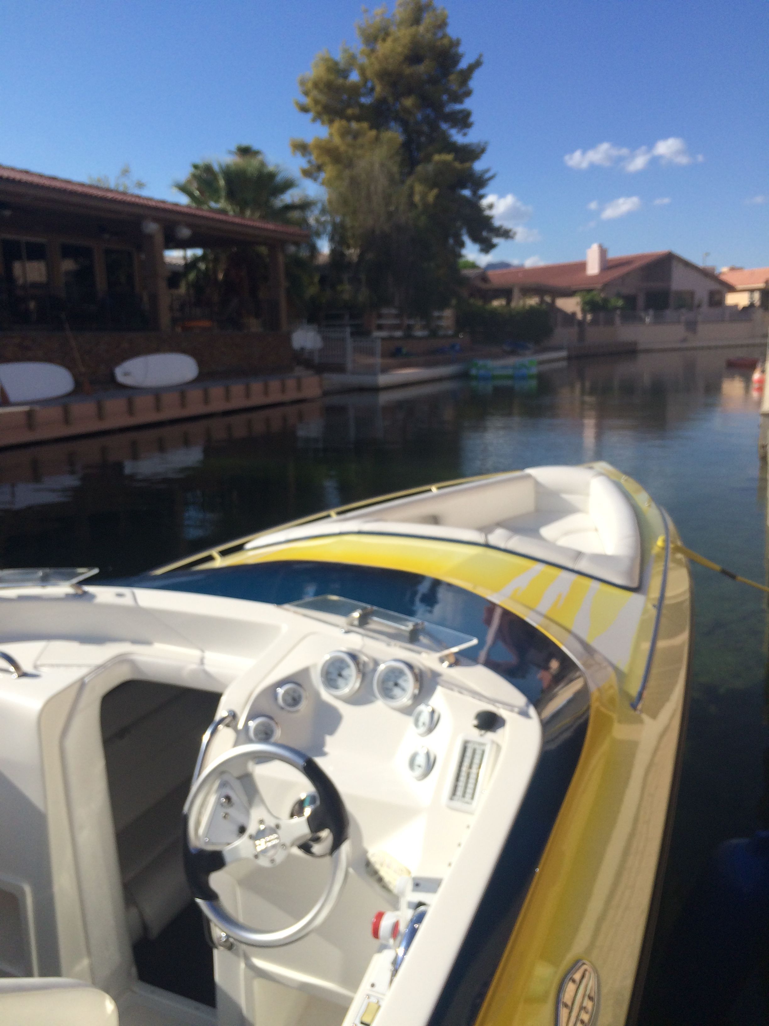 Yellow Lavey Craft 2750 NUERA boat docked, 2002 model.