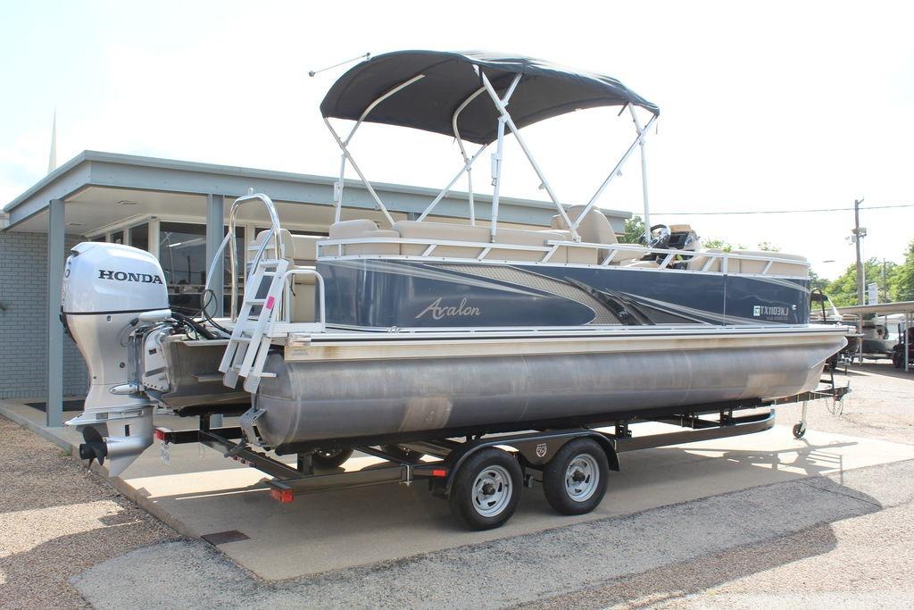 2021 Avalon VLS Quad Lounge 22 FT pontoon boat with Honda outboard motor on trailer.