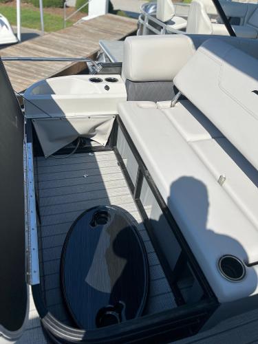 2024 Starcraft SLS 3 Q DH boat interior with seating and table.