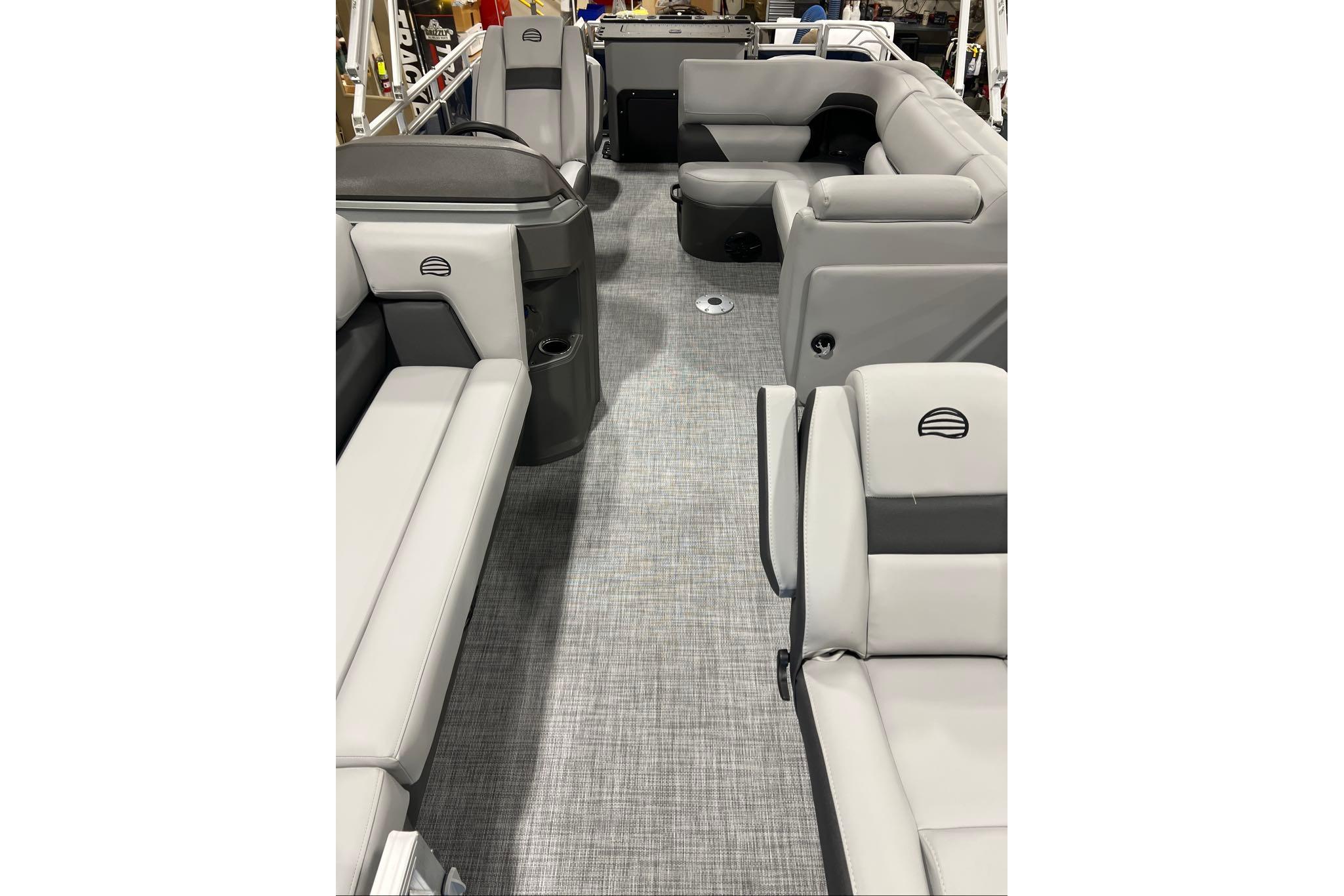 2026 Sun Tracker SportFish 20 DLX interior with gray seating and modern design.