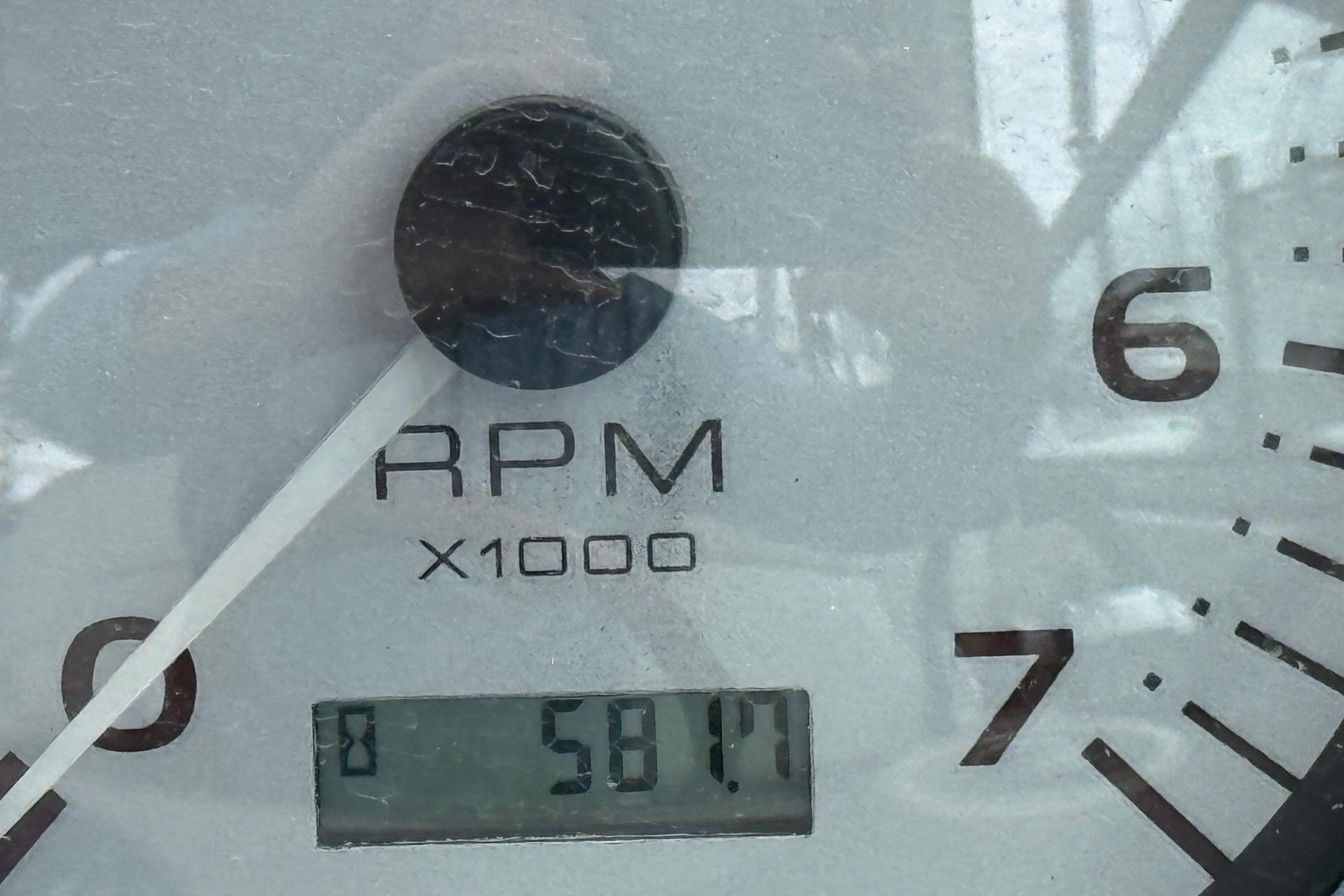 Close-up of a 2004 Rinker 342 tachometer showing 5817 RPM.