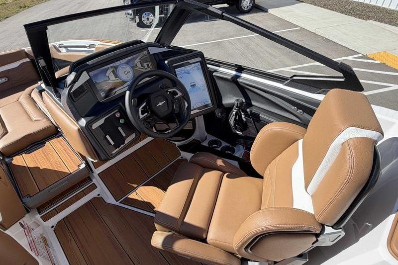 2026 Supra SL boat interior with tan leather seats and advanced dashboard controls.