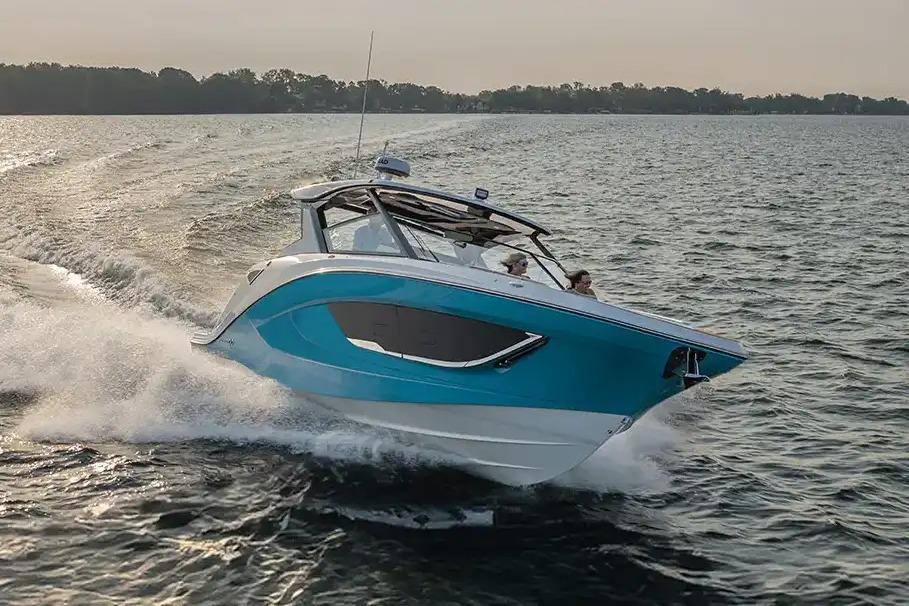 Manufacturer Provided Image: 2026 Hurricane SunDeck 3200 OB cruising on open water at sunset.