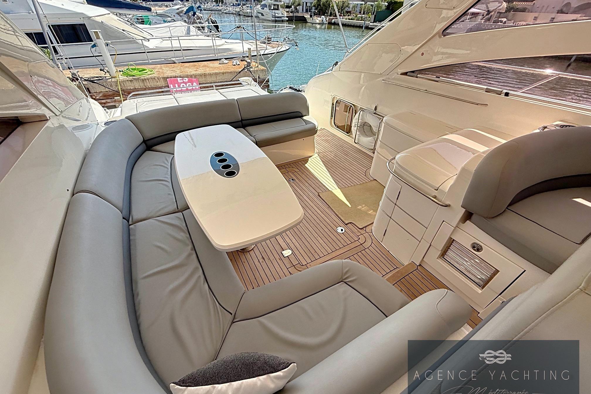 Luxurious 2004 Princess V58 yacht interior with elegant seating and sleek design.