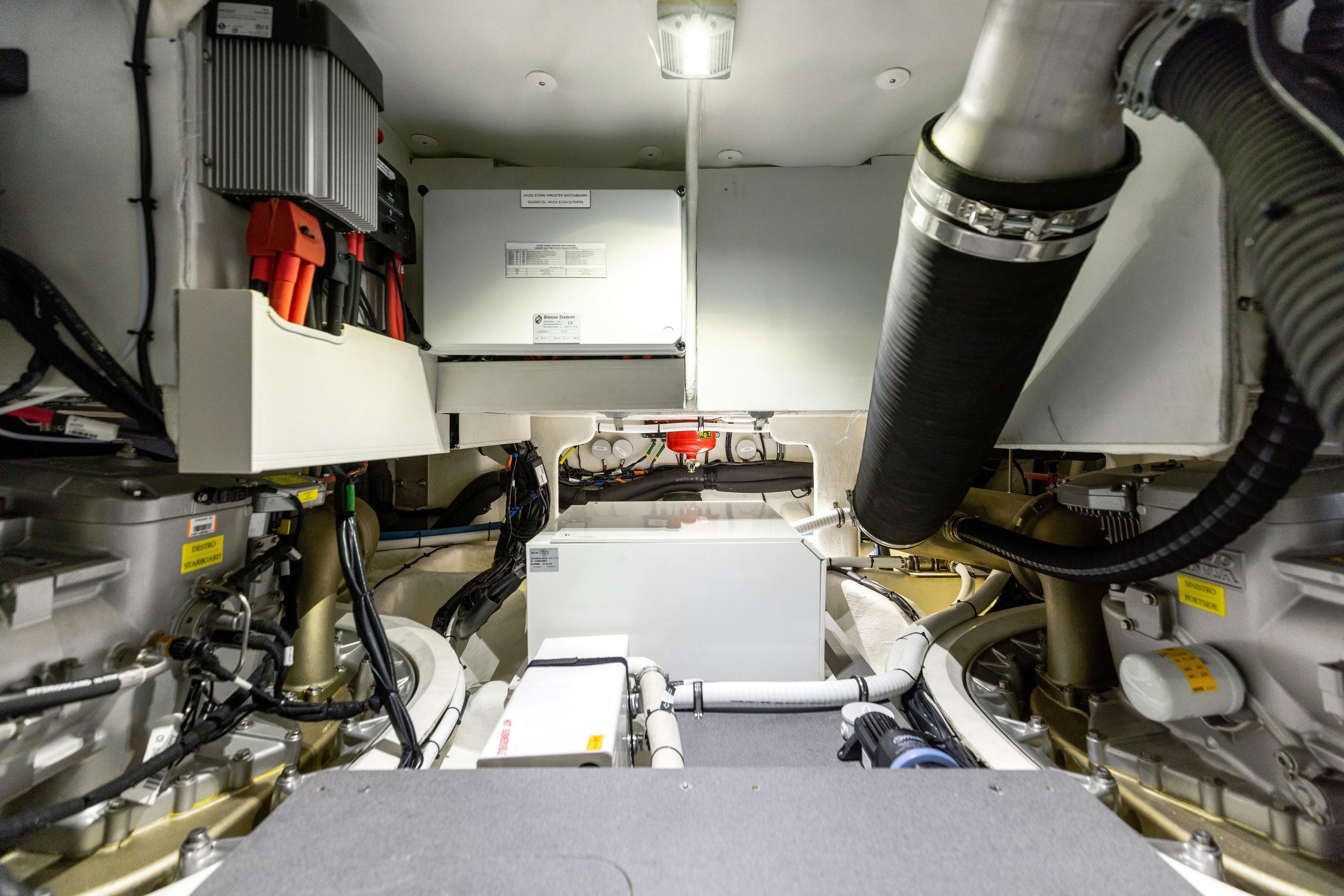Engine room of 2024 Absolute Navetta 64 yacht, showcasing advanced mechanical systems.