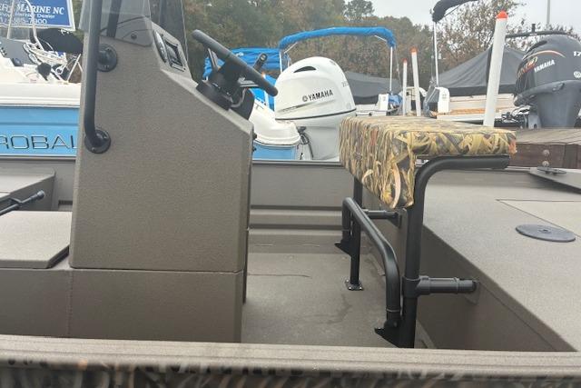 2026 Alweld 1760VV Marsh Console CC boat interior with camo seat and steering console.