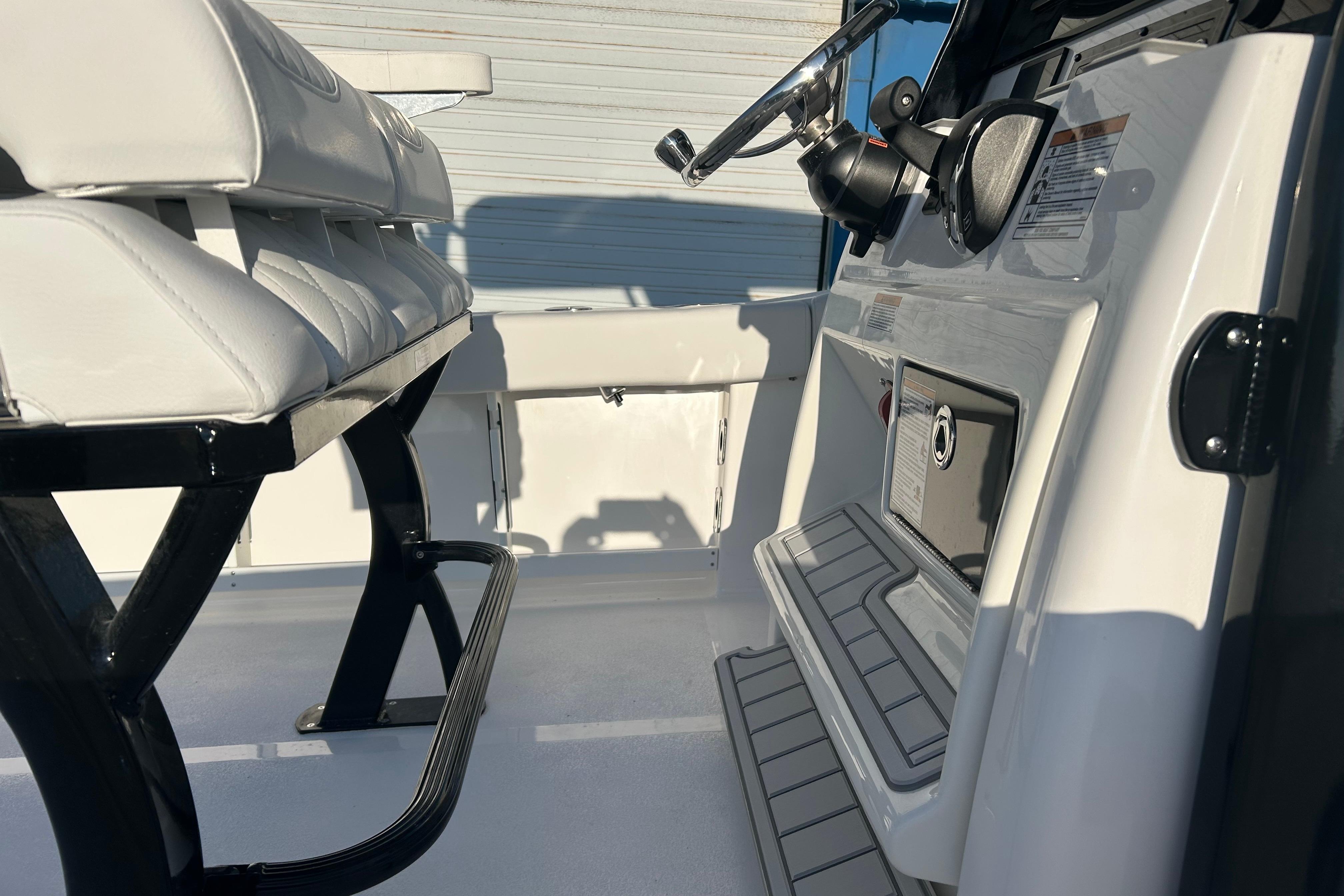 Interior view of 2026 Sea Fox 248 Commander boat, featuring sleek seating and modern controls.