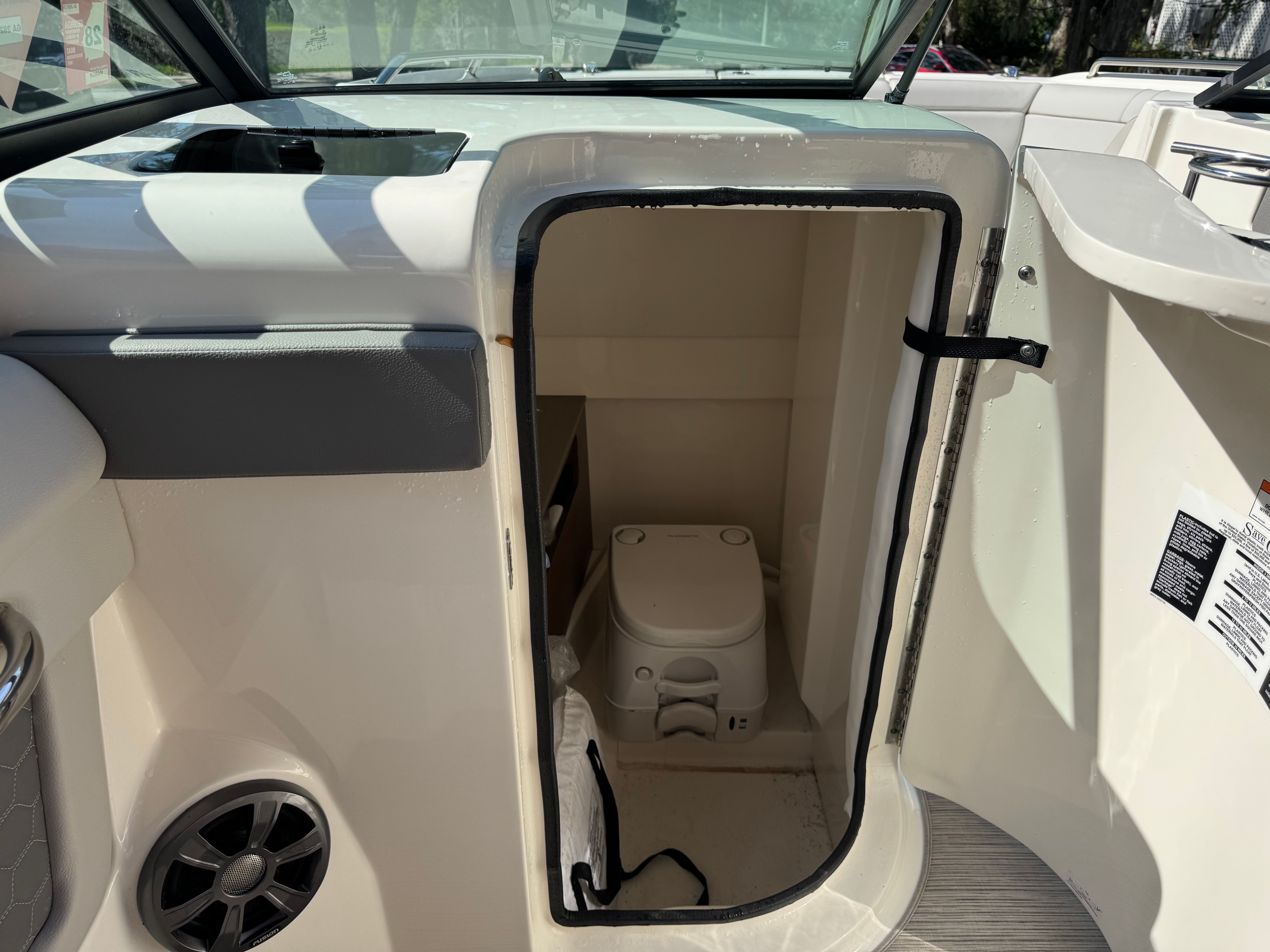 Interior of 2020 Sea Ray SDX 270 Outboard featuring a toilet.