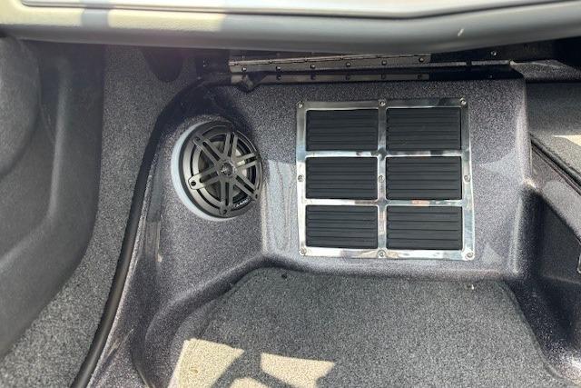 Interior view of a 2026 Ranger 212LS boat, featuring speaker and vent details.