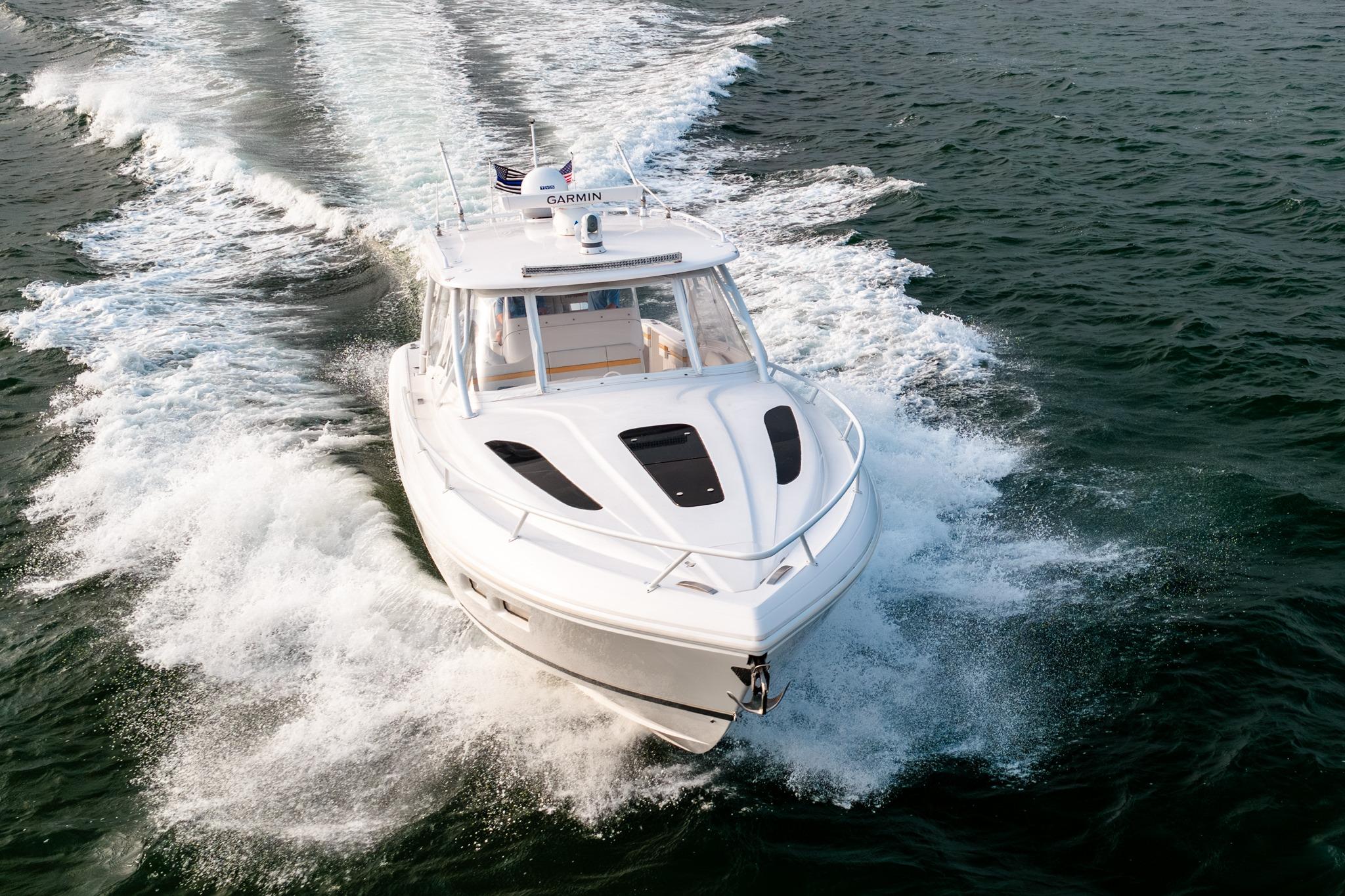 2020 Intrepid 407 Cuddy cruising on open water, showcasing sleek design and performance.