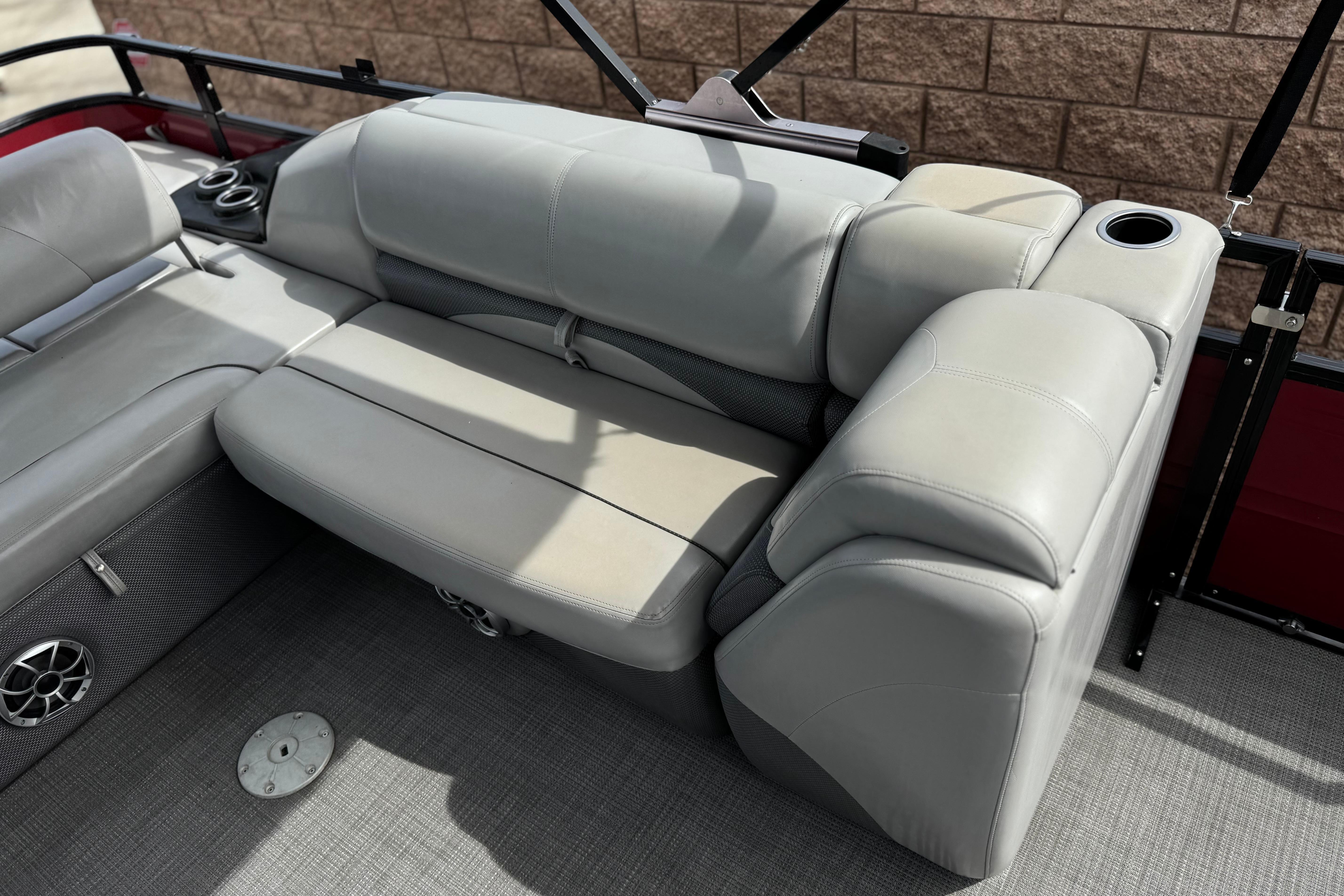 2022 Regency 250 DL3 boat interior with gray seating and cup holders.
