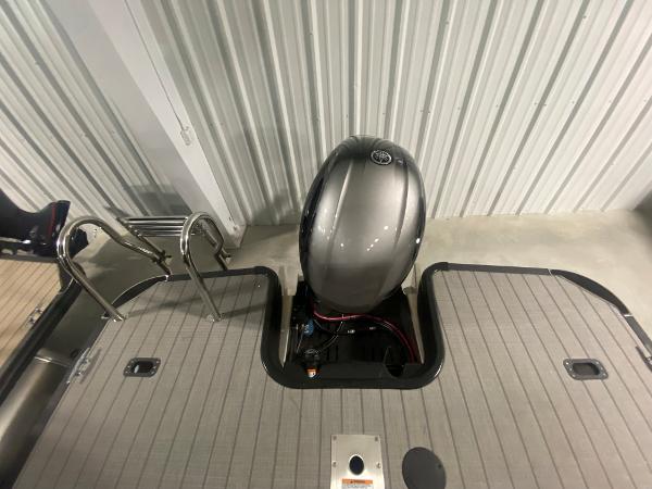 2024 Starcraft EXS 1 boat with outboard motor and swim ladder.