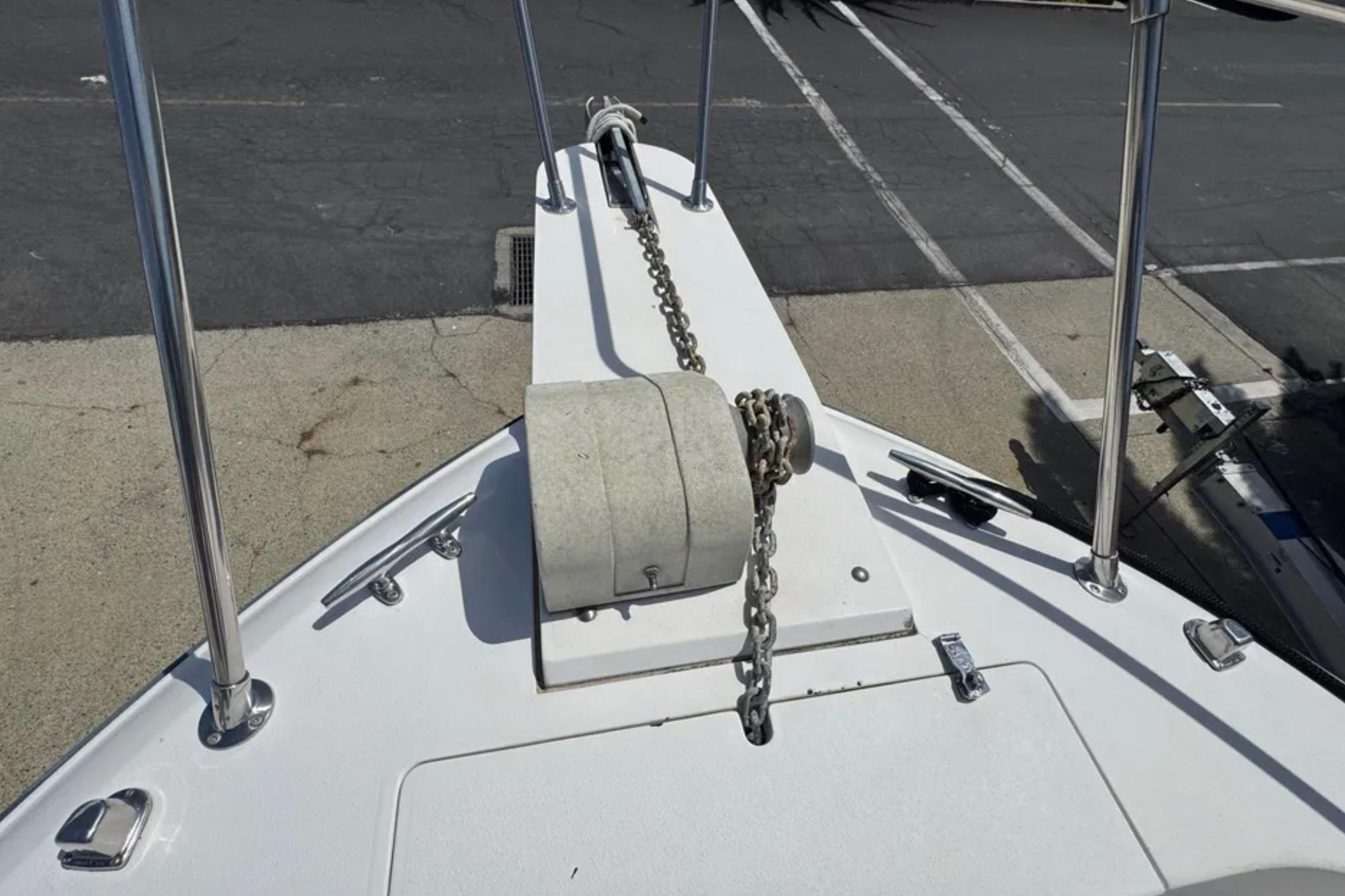 Bow of 1990 Grady-White Marlin 280 with anchor chain and winch.