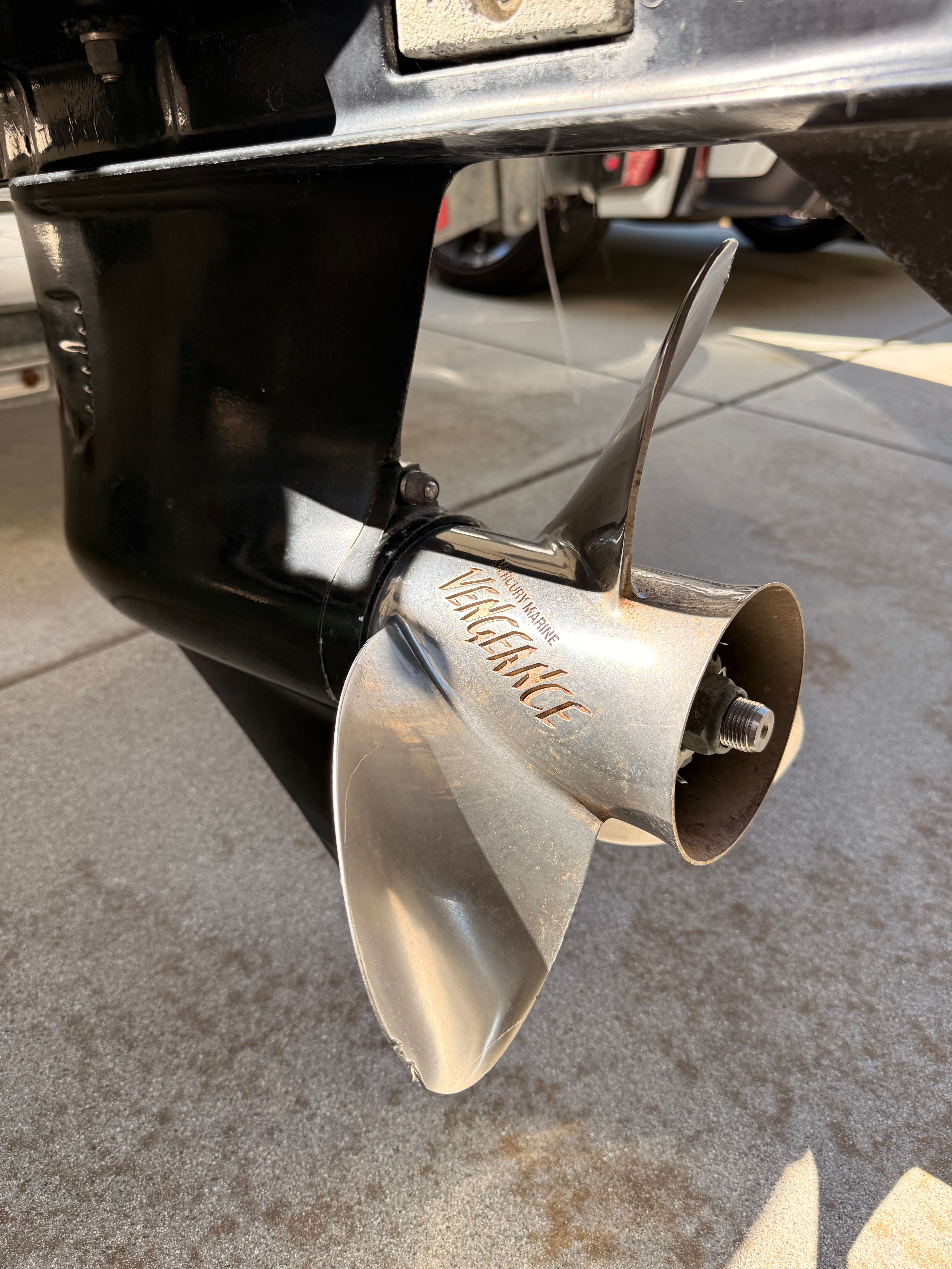 Close-up of a shiny propeller on a boat.