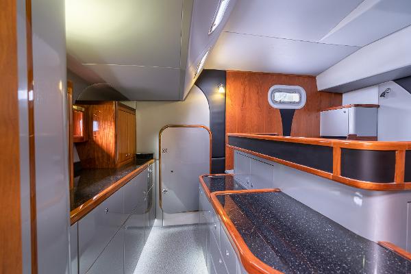 Luxurious interior of 2025 Shuttleworth 52 AeroRig yacht with modern design and wood accents.