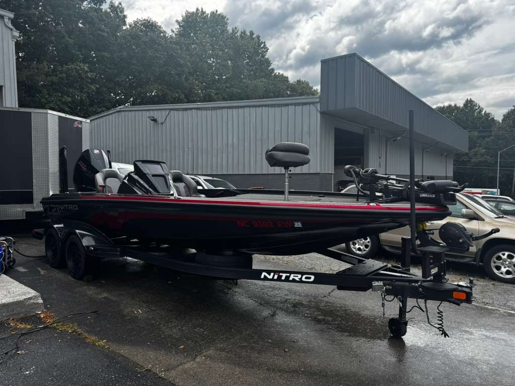2022 Nitro Z21 XL Pro boat on trailer outside building.