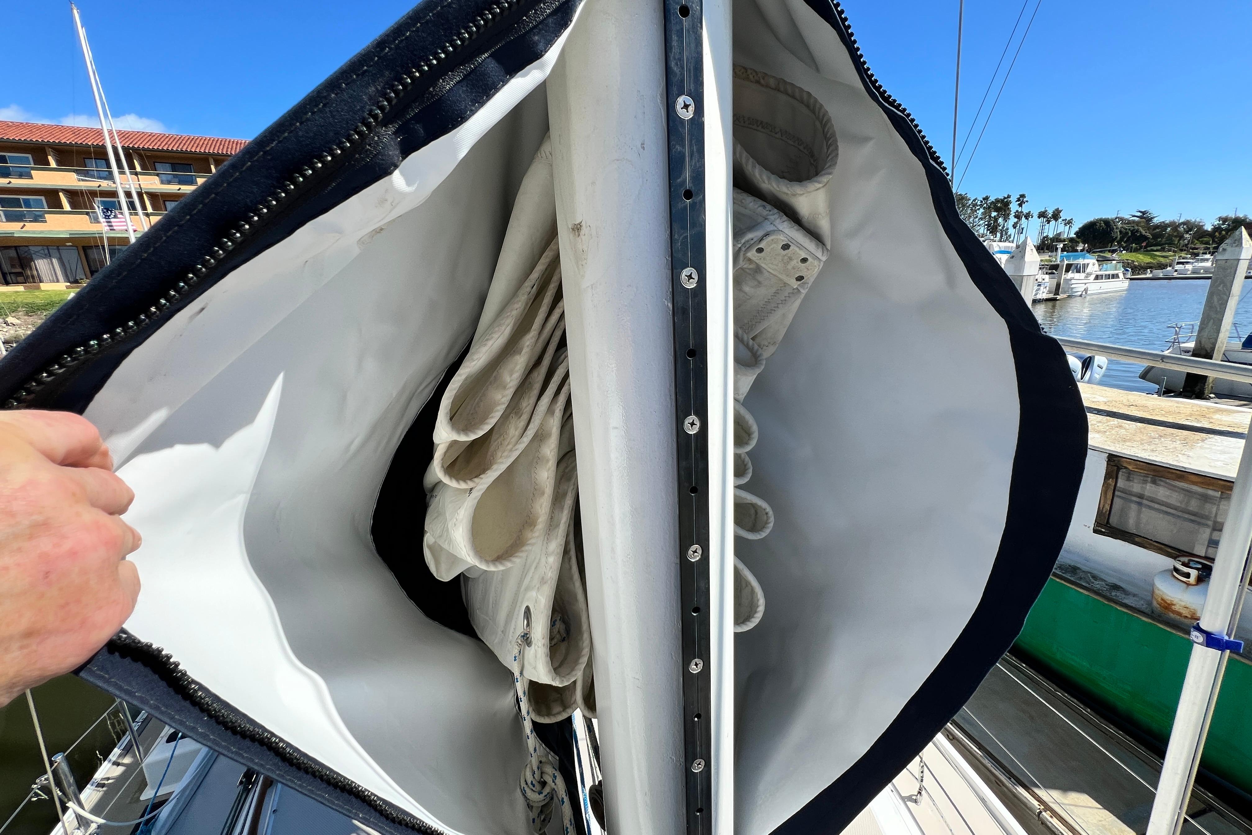 Sail storage on a 1987 Catalina 30 MkII yacht, docked at a marina.