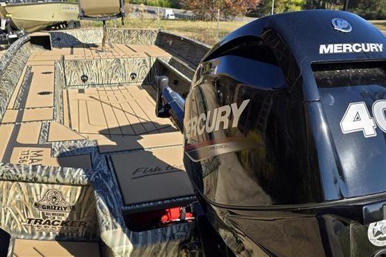 2026 Tracker Grizzly 1756 T Marsh boat with Mercury 40 engine, camo design.