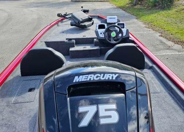 2025 Tracker Pro Team 175 boat with Mercury 75 engine, parked on pavement.