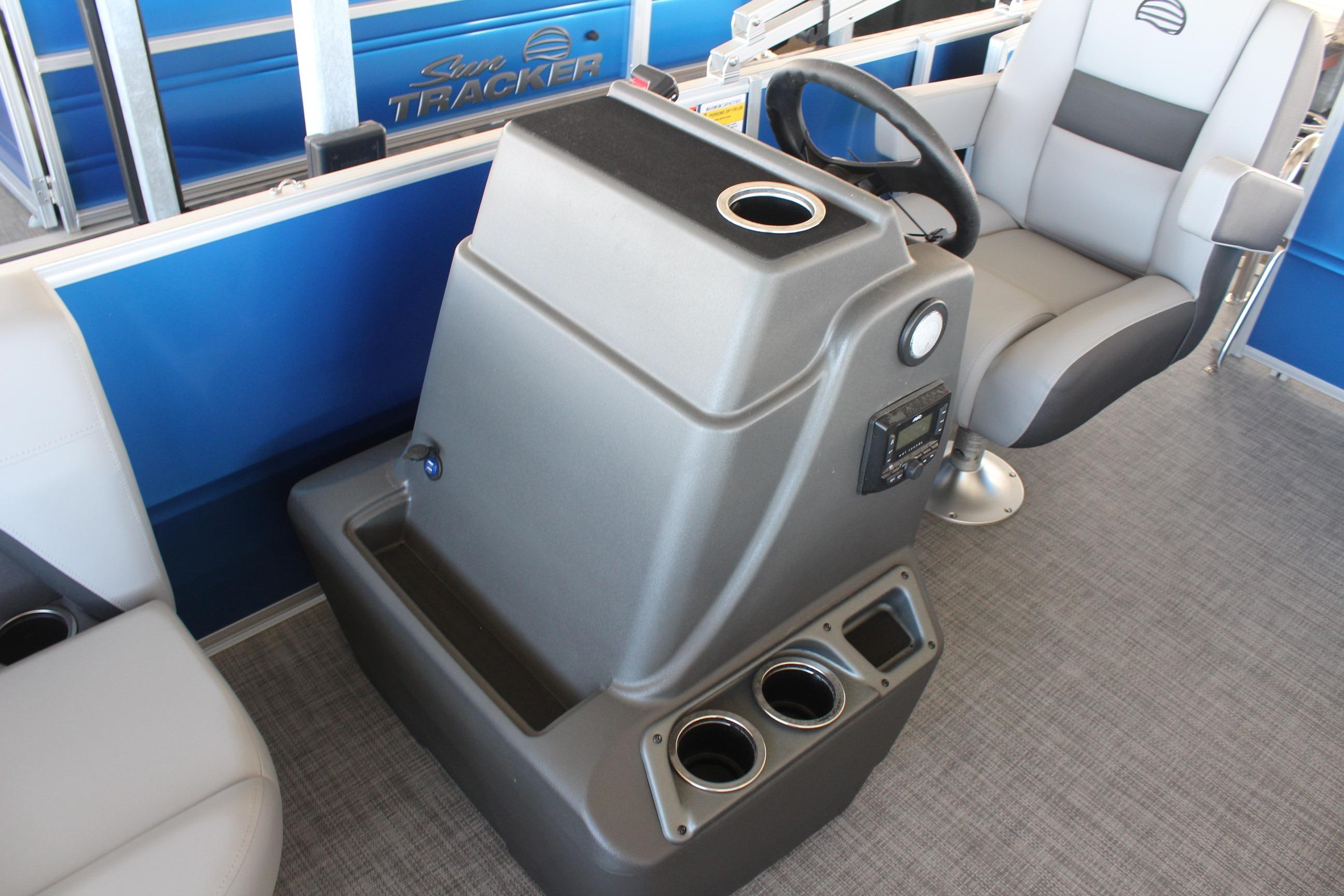 2026 Sun Tracker Party Barge 16 DLX interior with steering console and seating.