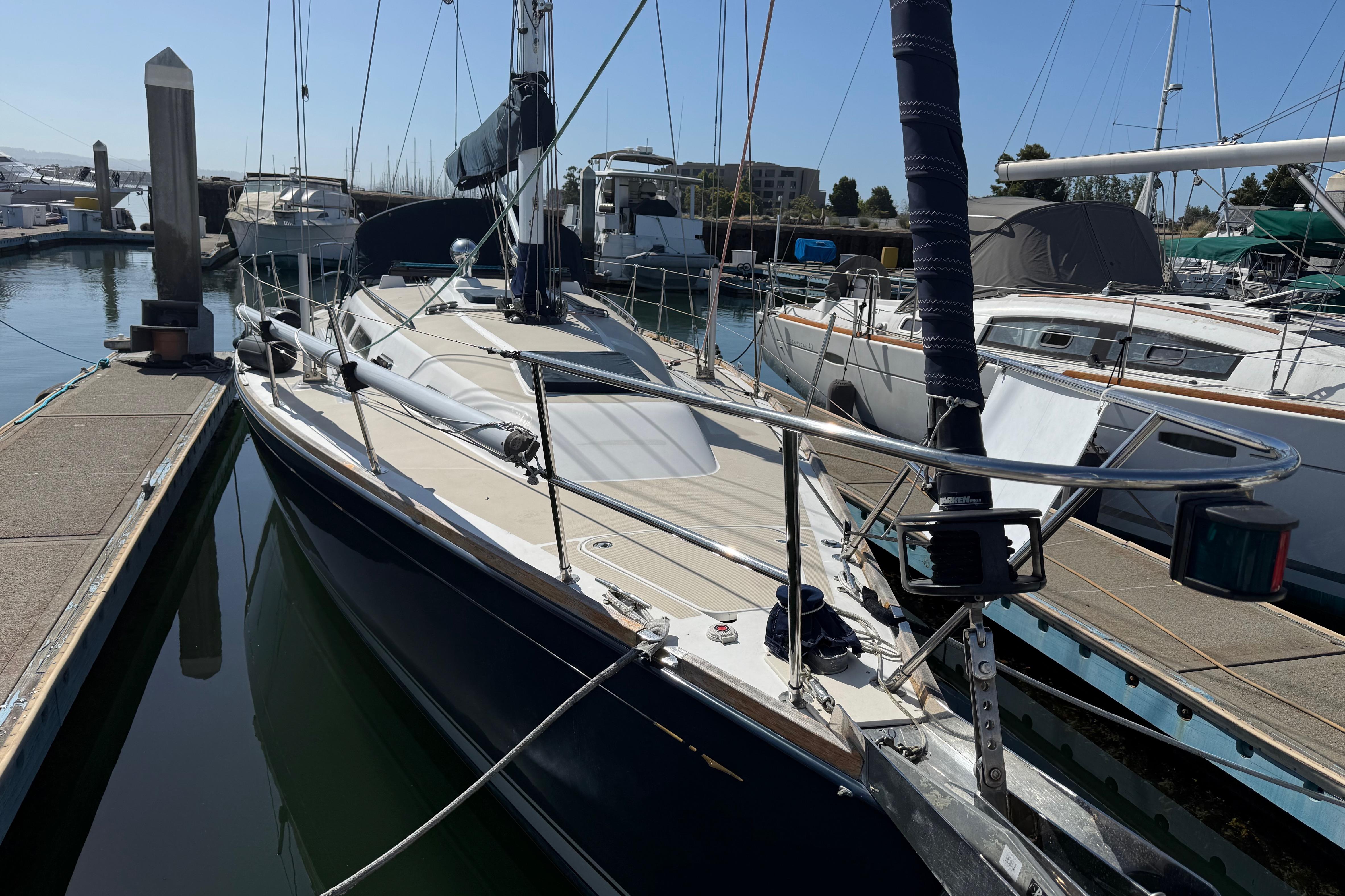 2004 Sabre 386 sailboat docked in a marina, showcasing sleek design and rigging.